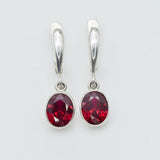 Created Ruby Earrings made in 925 Sterling Silver with Oval Created Red Ruby in Bezel setting, July Birthstone gift idea, symbolizes nobility, purity, and passion, ideal for everyday wear and perfect for birthday gifting and special occasions.