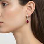 Ruby earrings in 925 sterling silver with red oval stones, July birthstone, a symbol of passion and ideal for special occasions.