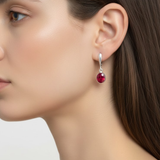 Ruby earrings in 925 sterling silver with red oval stones, July birthstone, a symbol of passion and ideal for special occasions.
