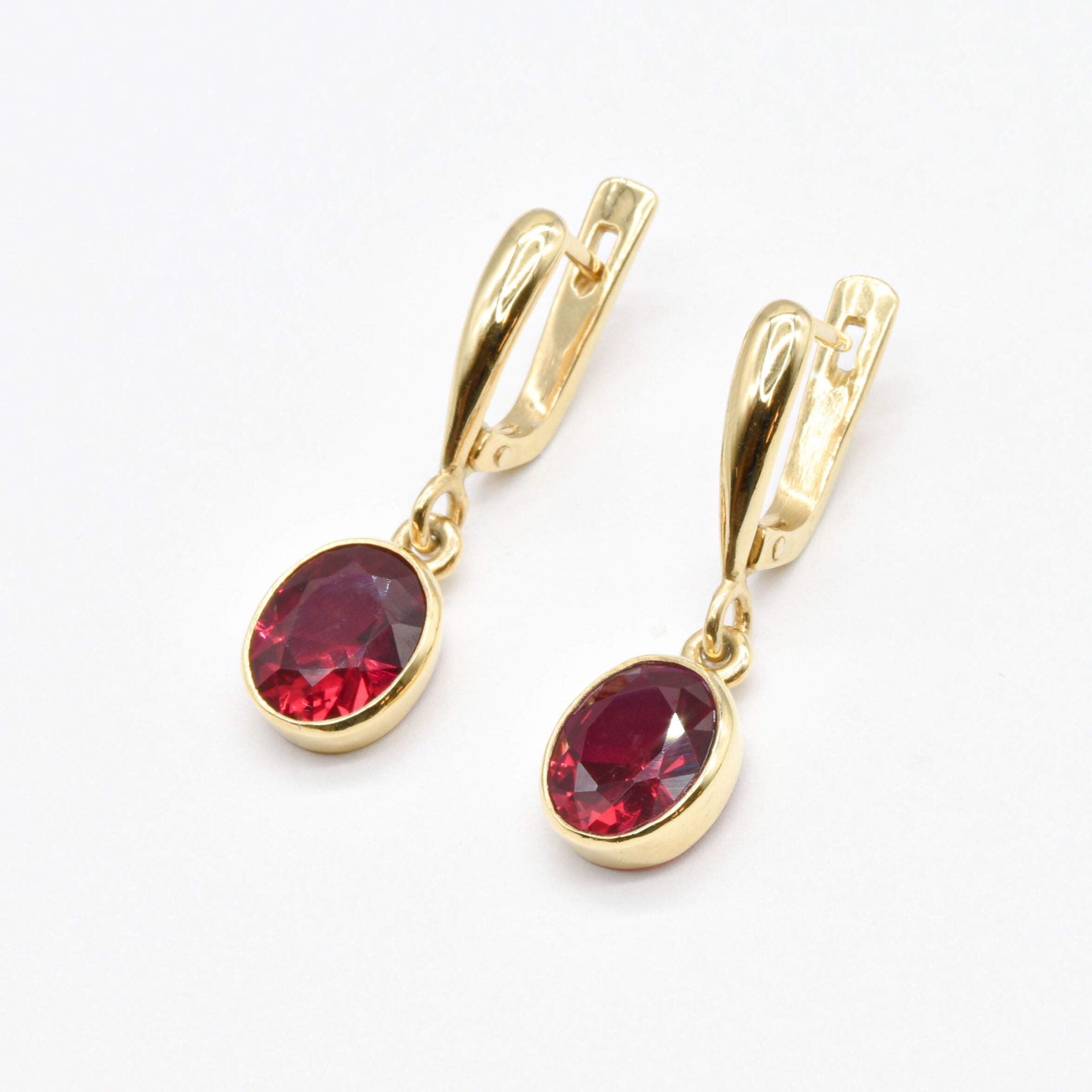 Elegant 18k Gold Vermeil earrings featuring a stunning created red ruby, ideal July birthstone gift for any occasion.