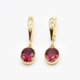 Created Ruby Earrings made in 18k Gold Vermeil with Oval Created Red Ruby in Bezel setting, July Birthstone gift idea, symbolizes nobility, purity, and passion, ideal for everyday wear and perfect for birthday gifting and special occasions.