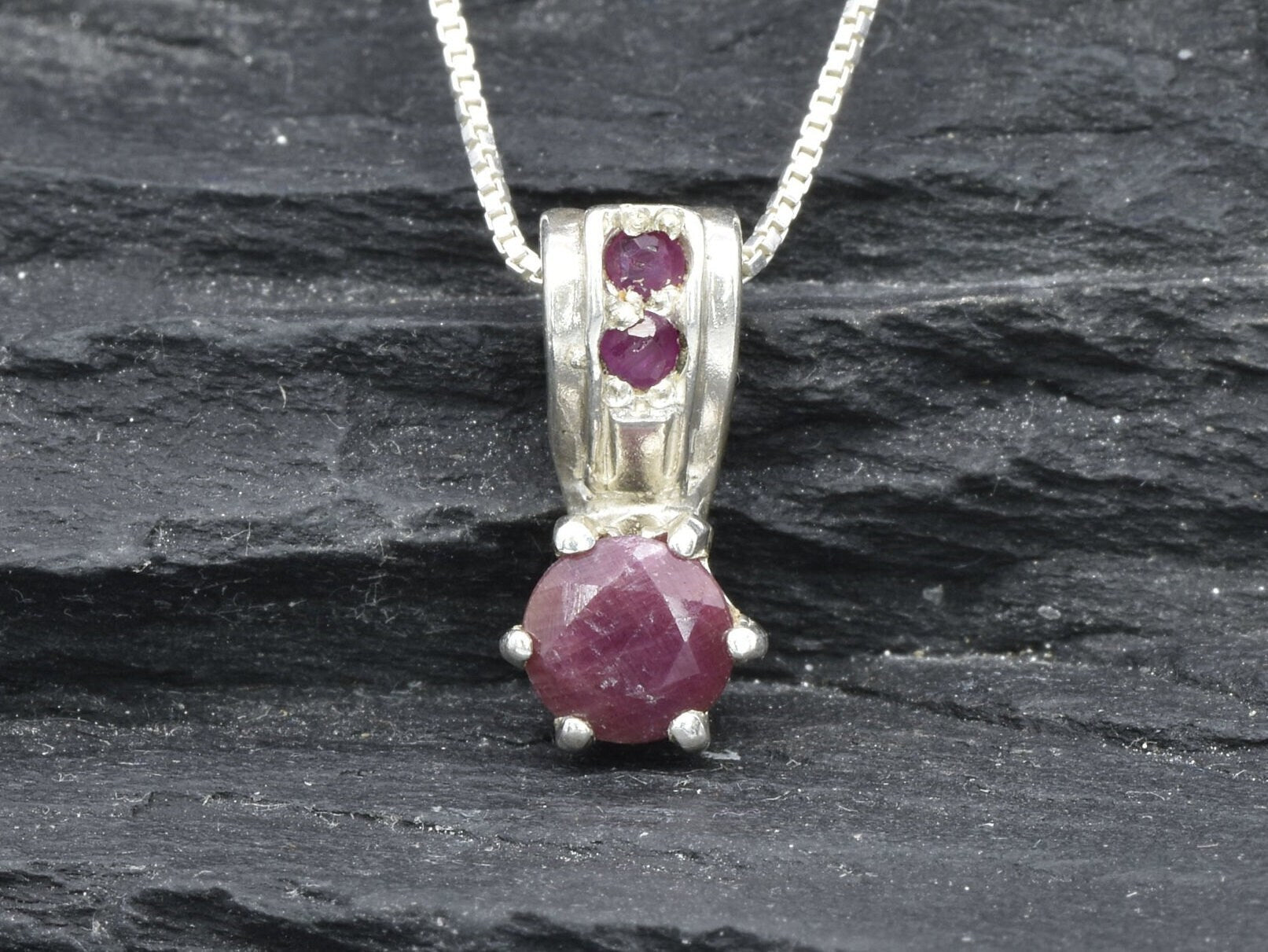 Charming 925 Sterling Silver pendant with a red ruby, ideal for July birthdays and a timeless accessory for any occasion.
