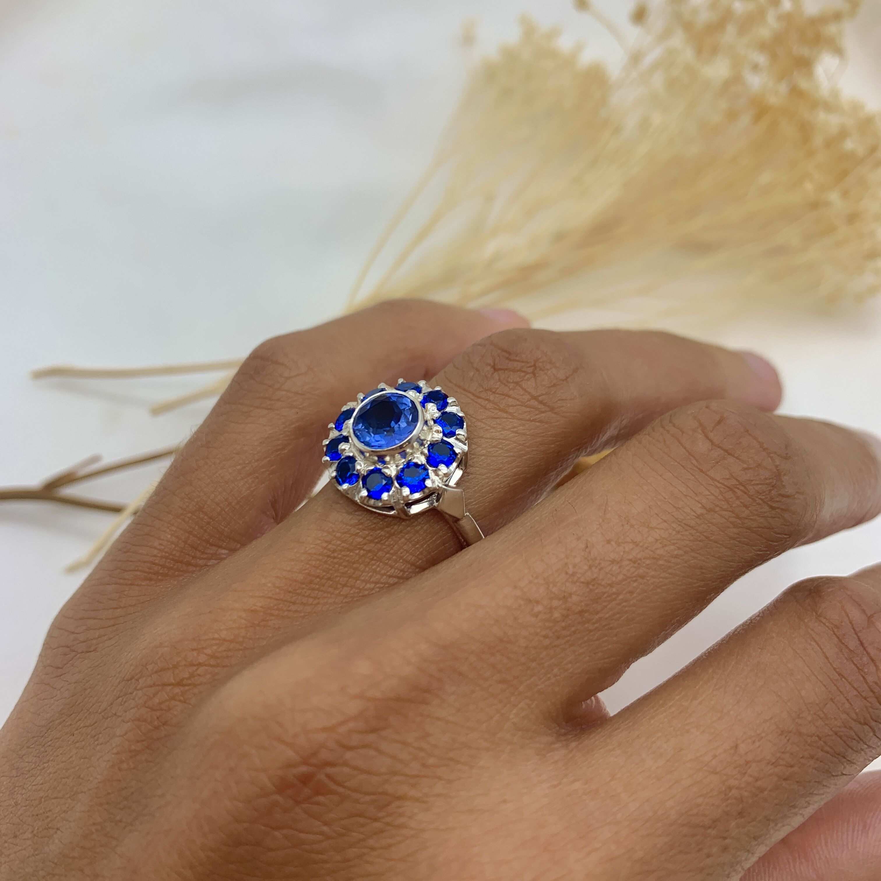 Sterling Silver Halo Ring featuring a Round Created Blue Sapphire, perfect September birthstone gift for any occasion.