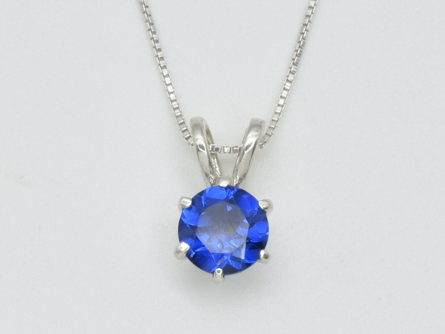 Created Sapphire Pendant made in 925 Sterling Silver with Round Created Blue Sapphire in Solitaire setting, September Birthstone gift idea, symbolizes sincerity, truth, and faithfulness, ideal for everyday wear and perfect for birthday gifting and special occasions.
