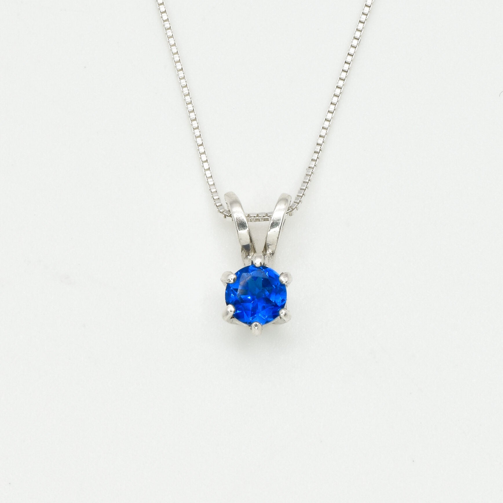Created Sapphire Pendant made in 925 Sterling Silver with Round Created Blue Sapphire in Solitaire setting, September Birthstone gift idea, symbolizes sincerity, truth, and faithfulness, ideal for everyday wear and perfect for birthday gifting and special occasions.