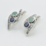 A bustling city street during sunset, with cars and pedestrians creating a vibrant urban atmosphere.