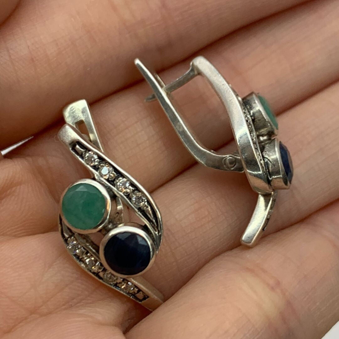 A serene beach at dawn, with gentle waves lapping at the shore and soft pastel colors in the sky.