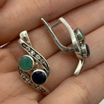 A serene beach at dawn, with gentle waves lapping at the shore and soft pastel colors in the sky.