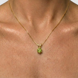 Round peridot pendant on 18k gold vermeil chain, close-up, perfect August birthday gift