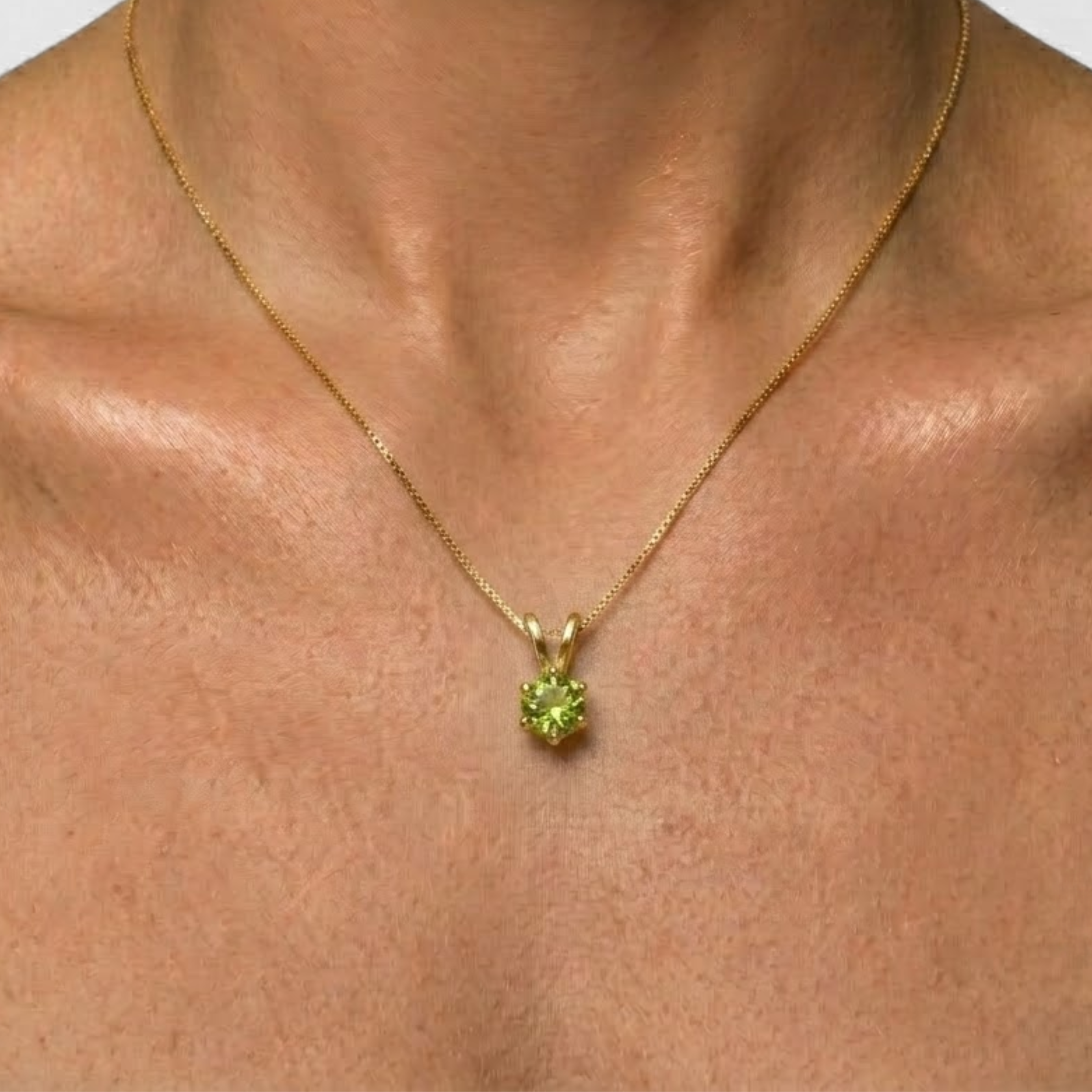 Round peridot pendant on 18k gold vermeil chain, close-up, perfect August birthday gift