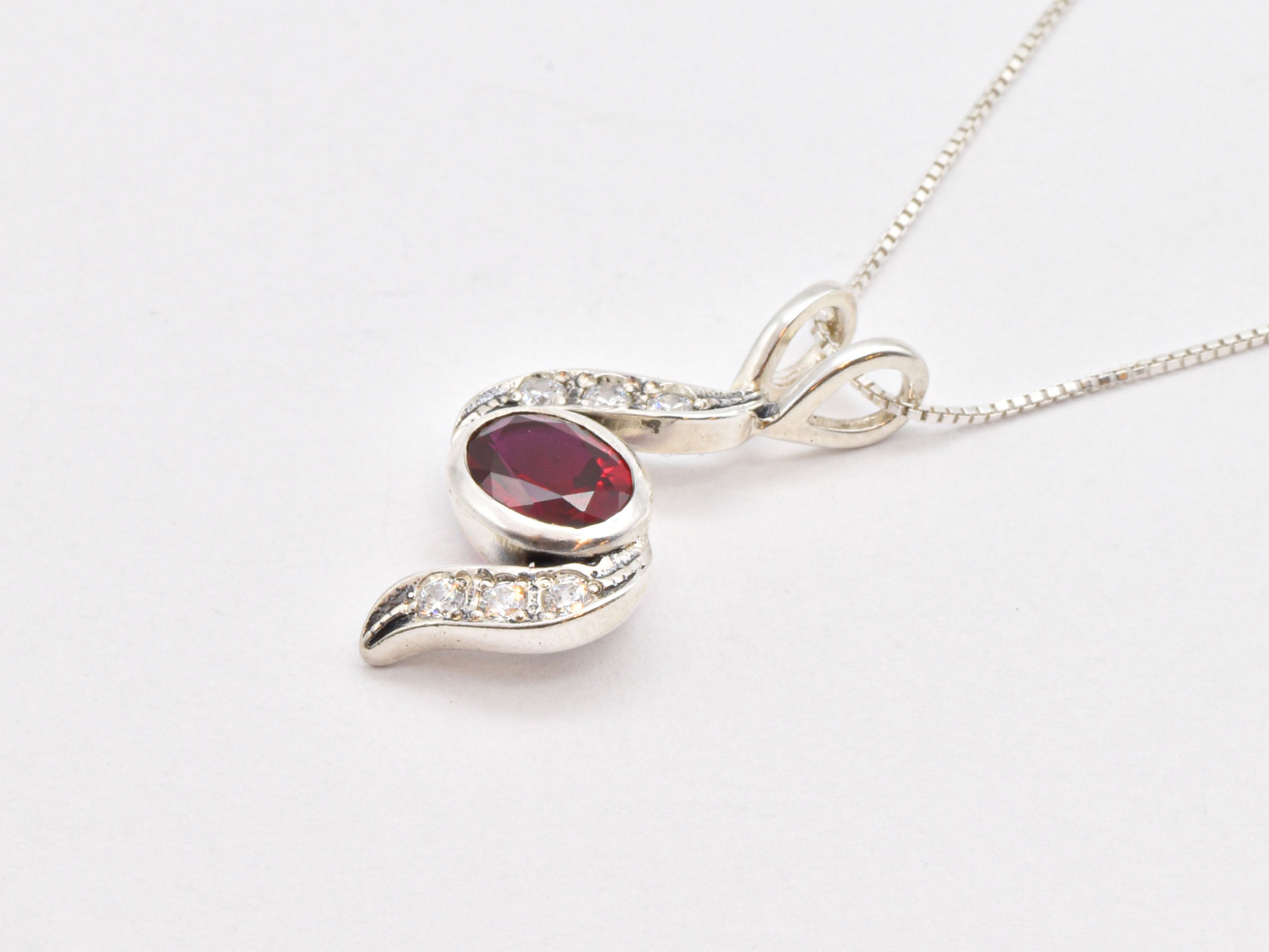 Stunning Ruby Pendant in 925 Sterling Silver, showcasing a Created Red Ruby, a meaningful gift for July birthdays.