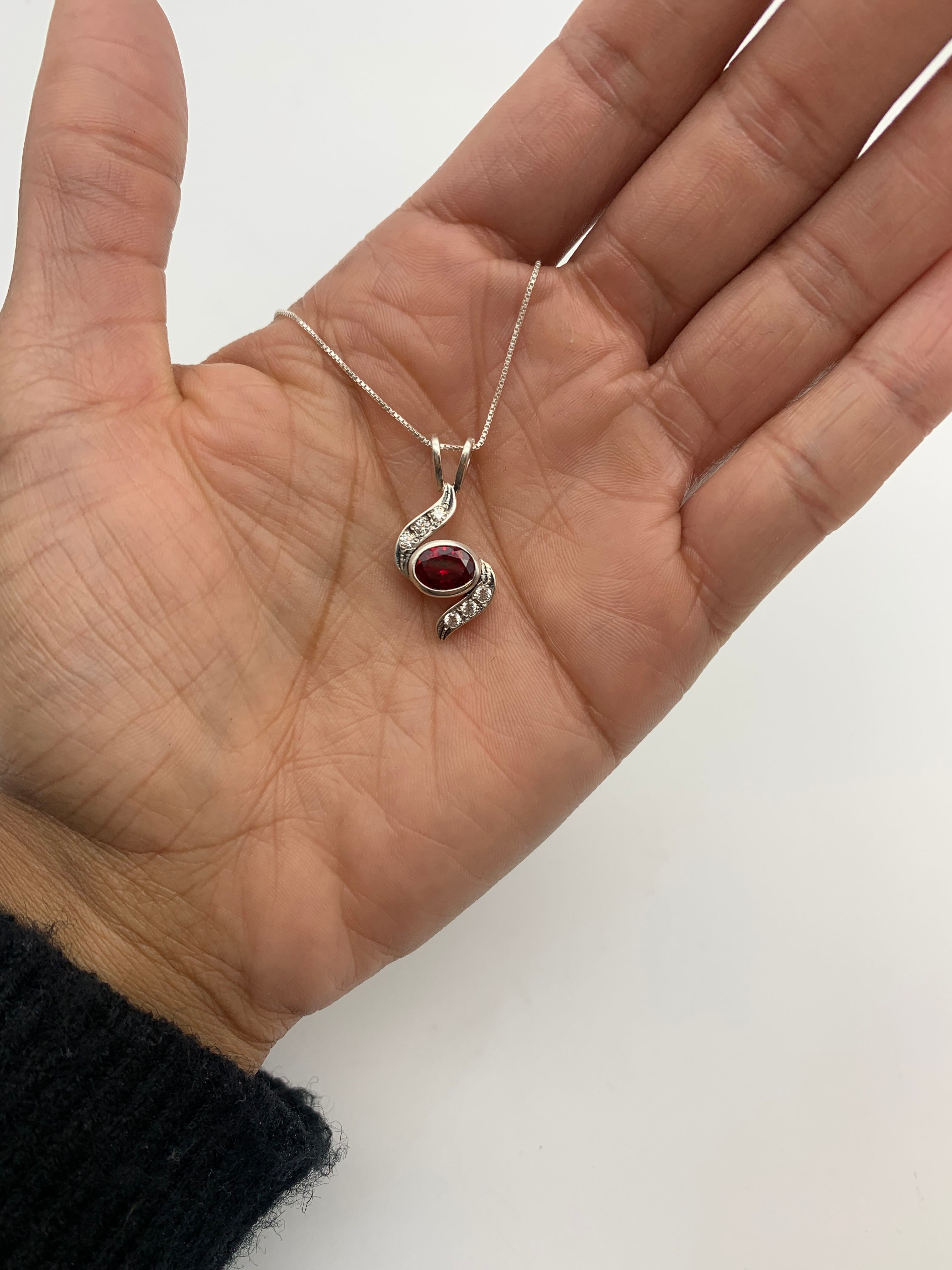 Beautiful 925 Sterling Silver Ruby Pendant with Oval Created Red Ruby, a timeless accessory for any occasion.