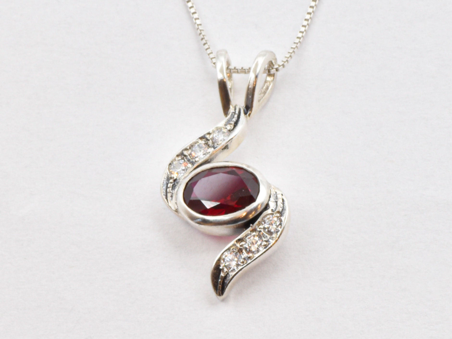 Created Ruby Pendant made in 925 Sterling Silver with Oval Created Red Ruby in Bezel setting, July Birthstone gift idea, symbolizes nobility, purity, and passion, ideal for everyday wear and perfect for birthday gifting and special occasions.