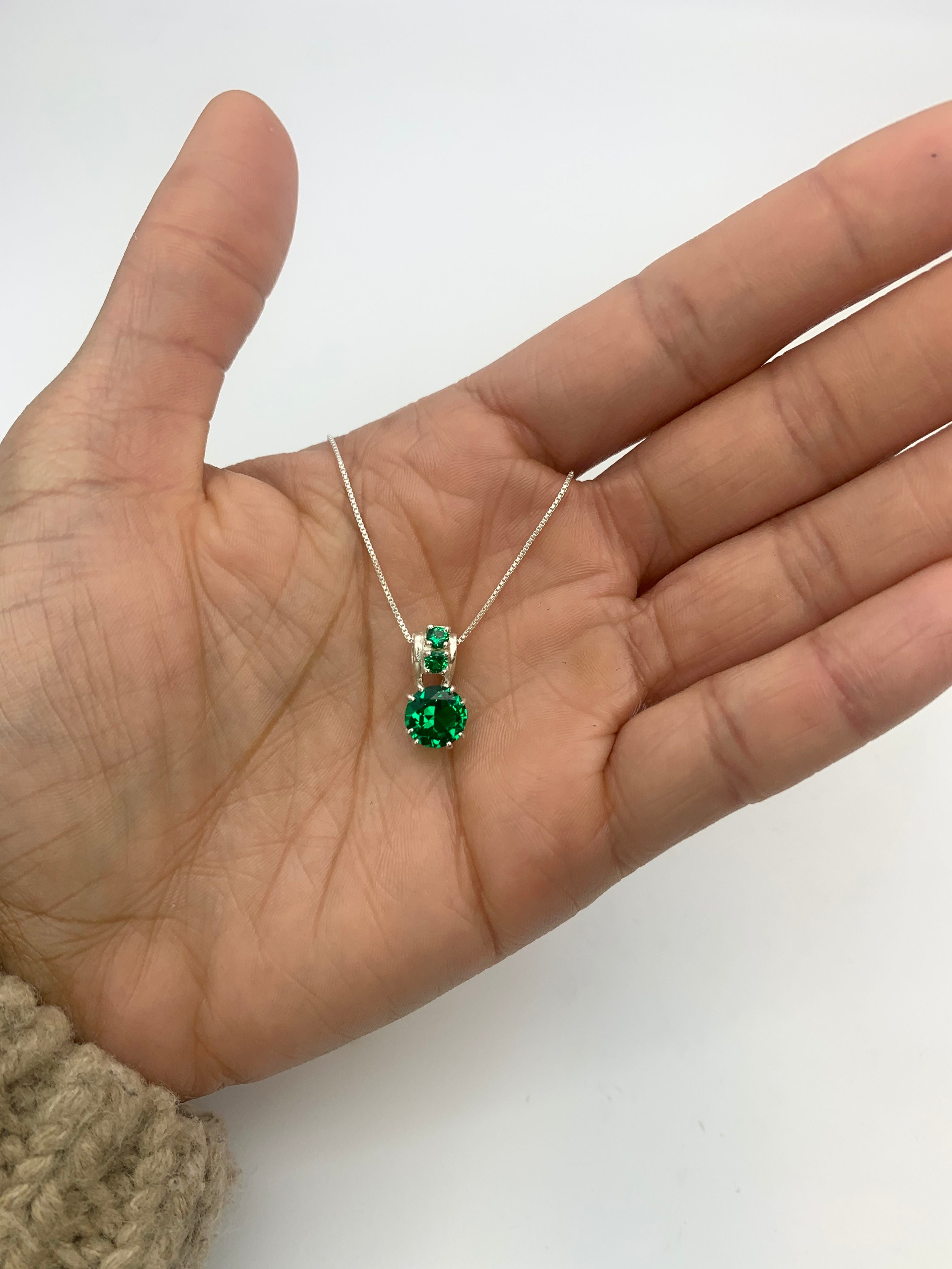 Charming Created Emerald Pendant in 925 Sterling Silver, symbolizes love and renewal, perfect for daily wear and celebrations.