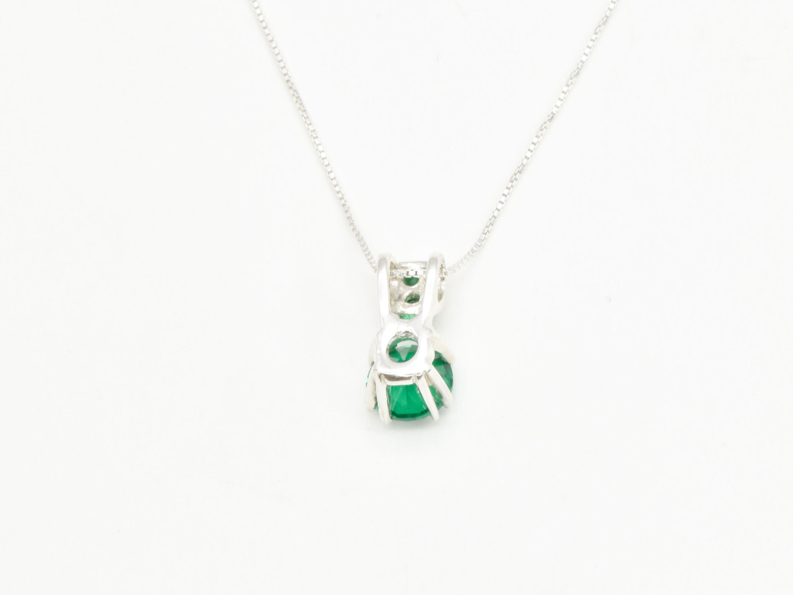 Graceful 925 Sterling Silver Pendant featuring a Round Created Green Emerald, an ideal token for May birthdays and festive moments.