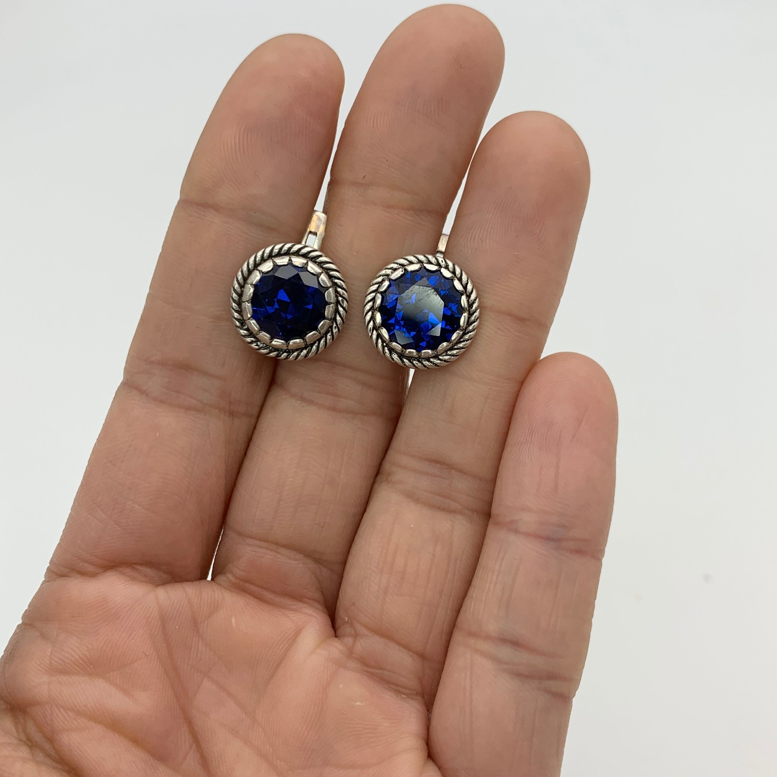 Elegant created sapphire earrings in 925 Sterling Silver, perfect for birthdays and special occasions, symbolizing sincerity and faithfulness.