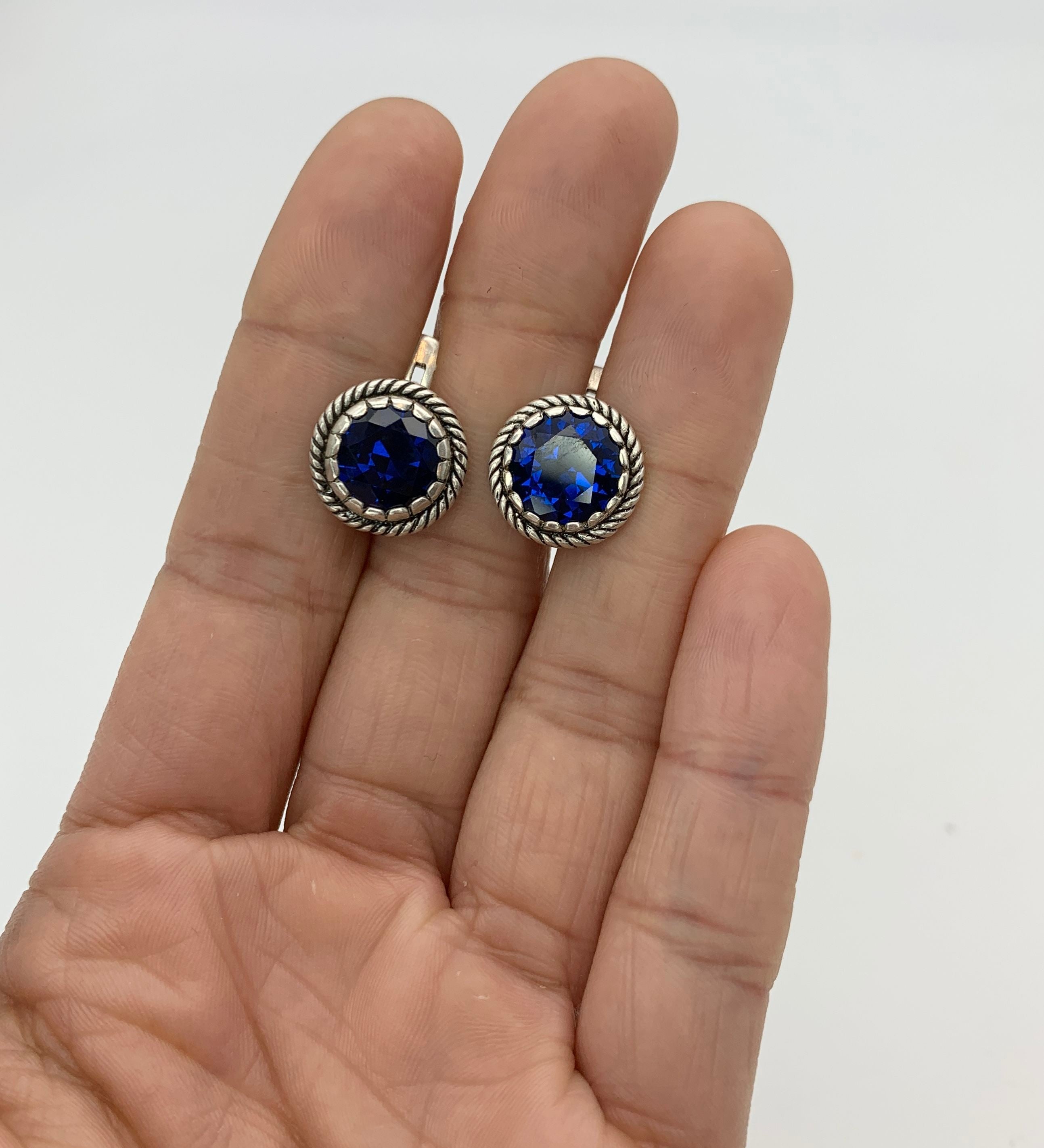 Elegant created sapphire earrings in 925 Sterling Silver, perfect for birthdays and special occasions, symbolizing sincerity and faithfulness.