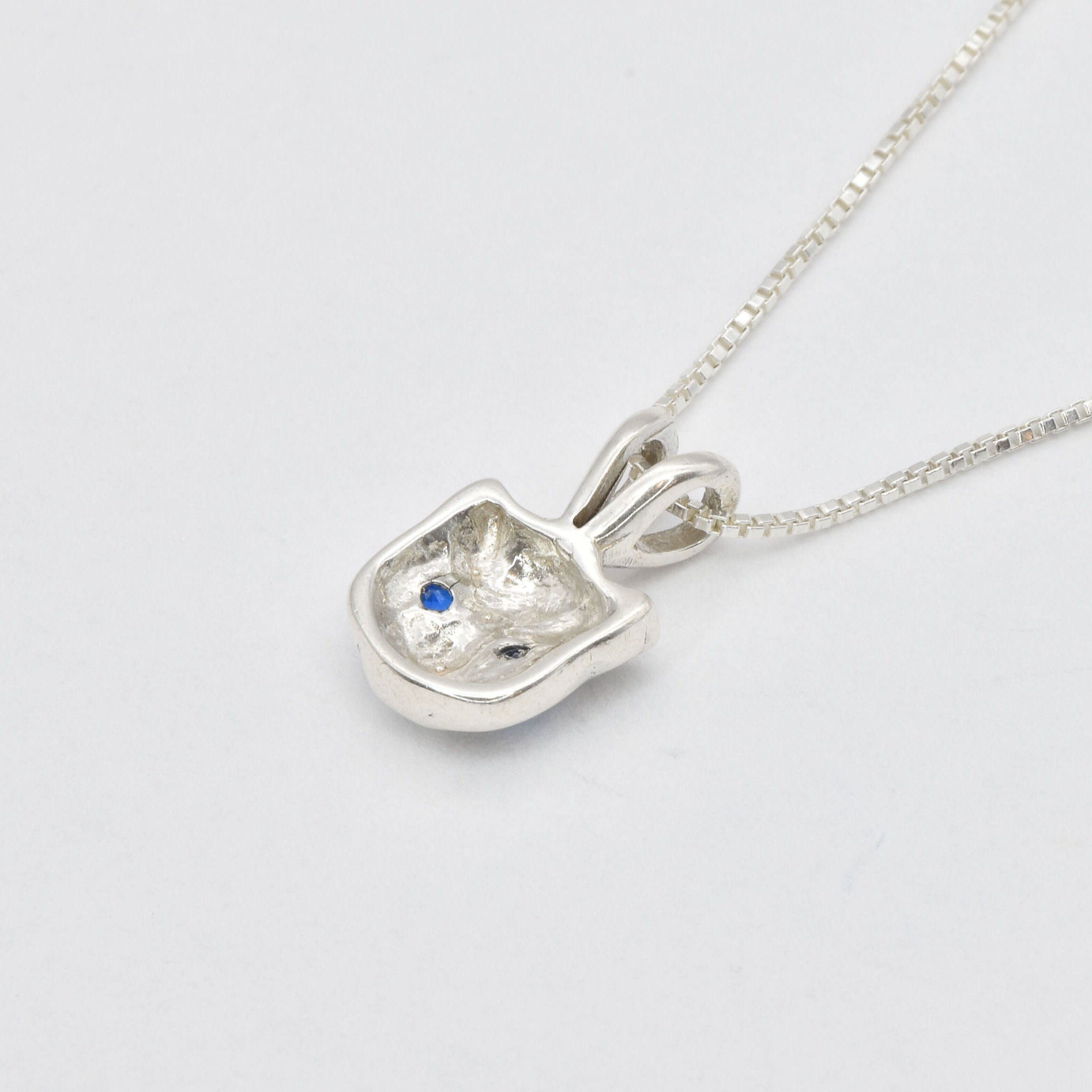 Stunning created sapphire pendant in 925 sterling silver, featuring a round blue sapphire, perfect for everyday elegance.