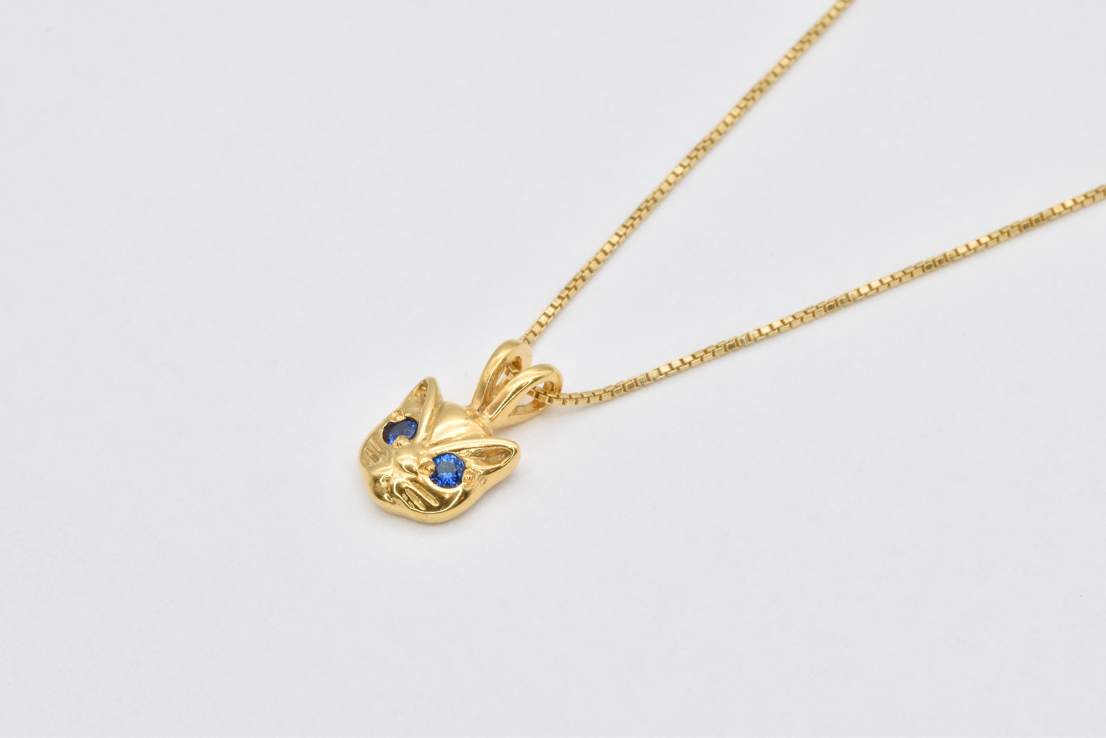 Elegant 18k Gold Vermeil Sapphire Pendant featuring a Round Created Blue Sapphire, symbolizes loyalty and ideal for daily wear.