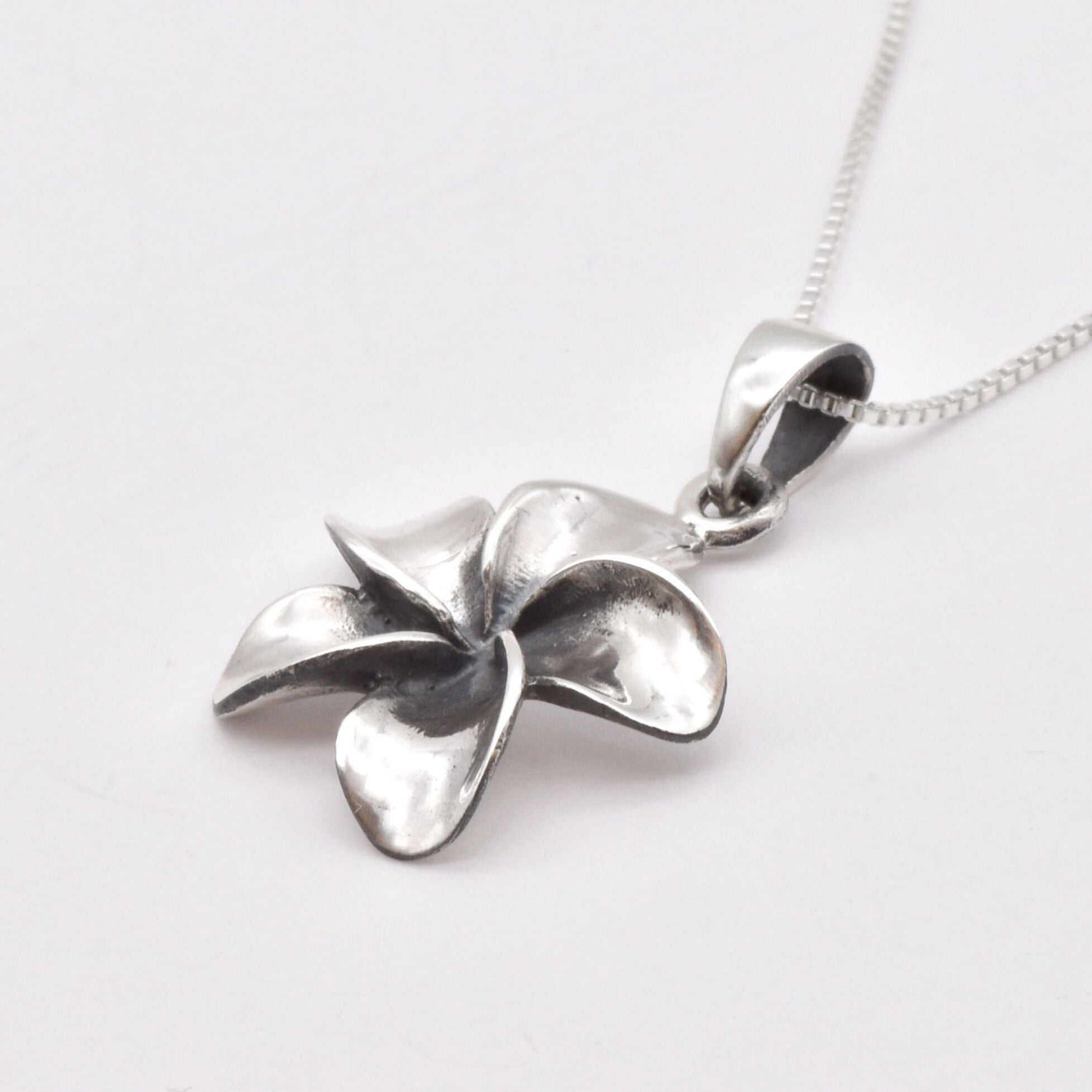 Stunning Silver Plumeria Flower Necklace, crafted in 925 Sterling Silver for a chic, everyday accessory.