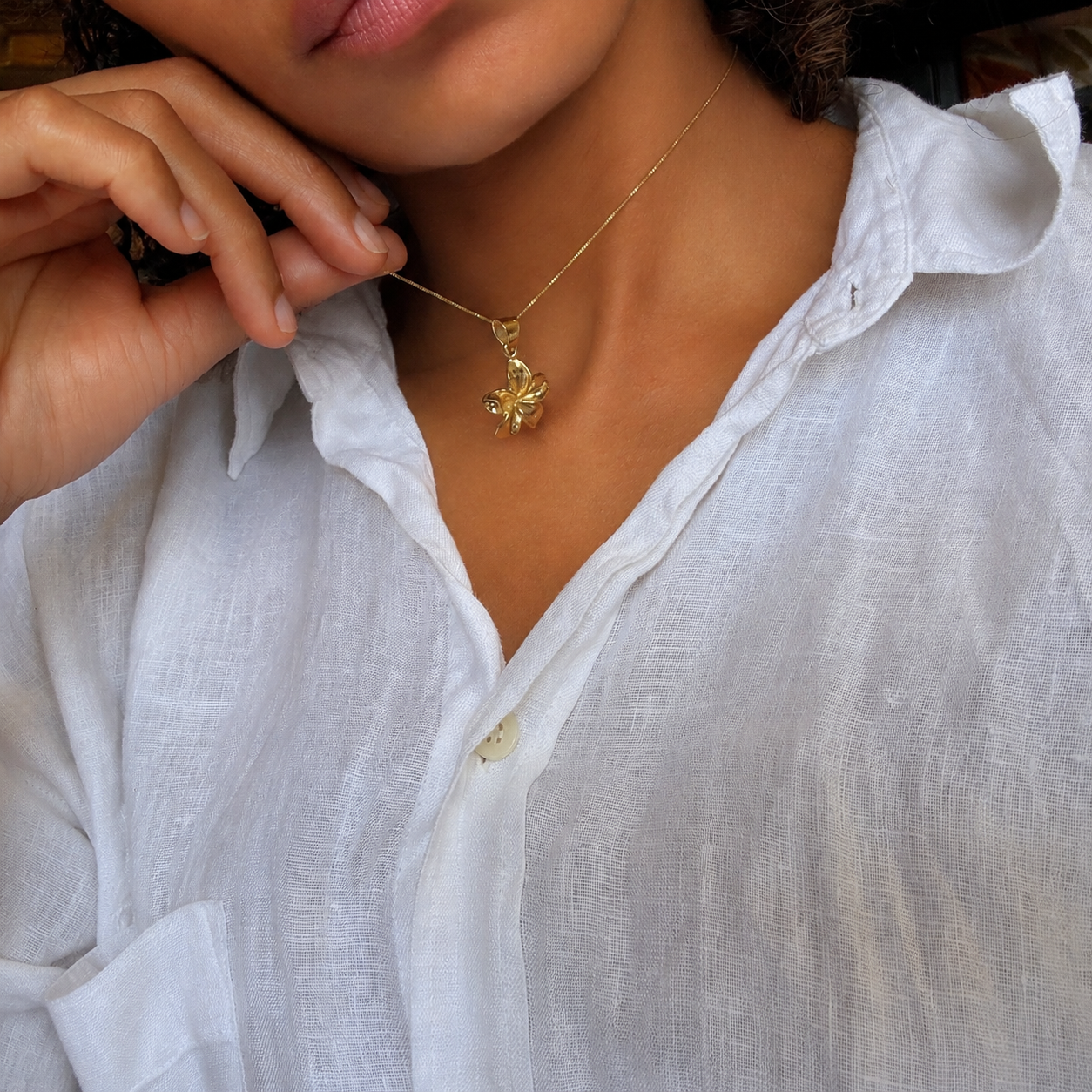 Stunning Gold Plumeria Flower Pendant Necklace in 18k Gold Vermeil, perfect for adding a tropical touch to any outfit.