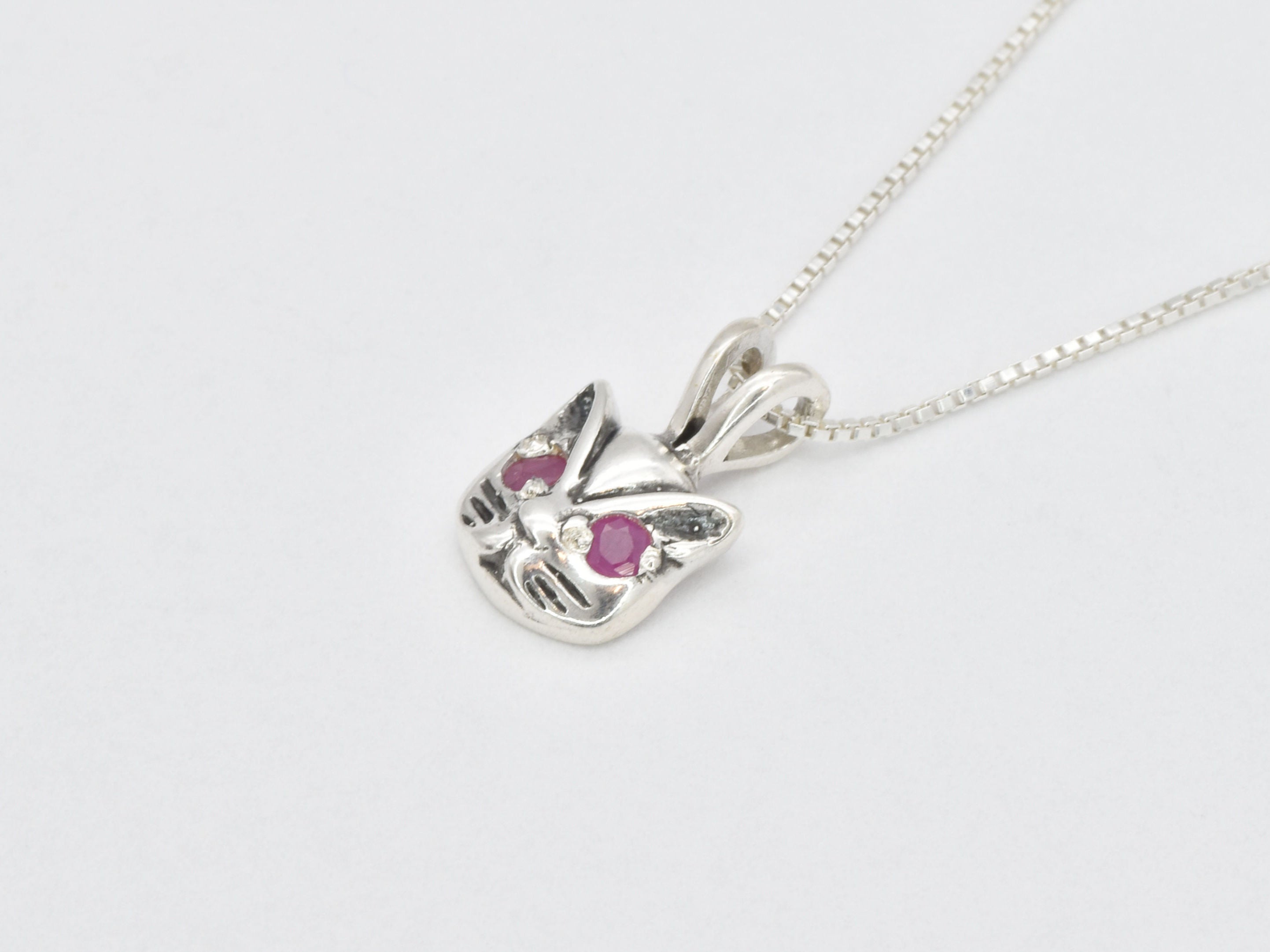 Elegant 925 Sterling Silver pendant showcasing a round natural ruby, ideal for birthdays and meaningful gifts.