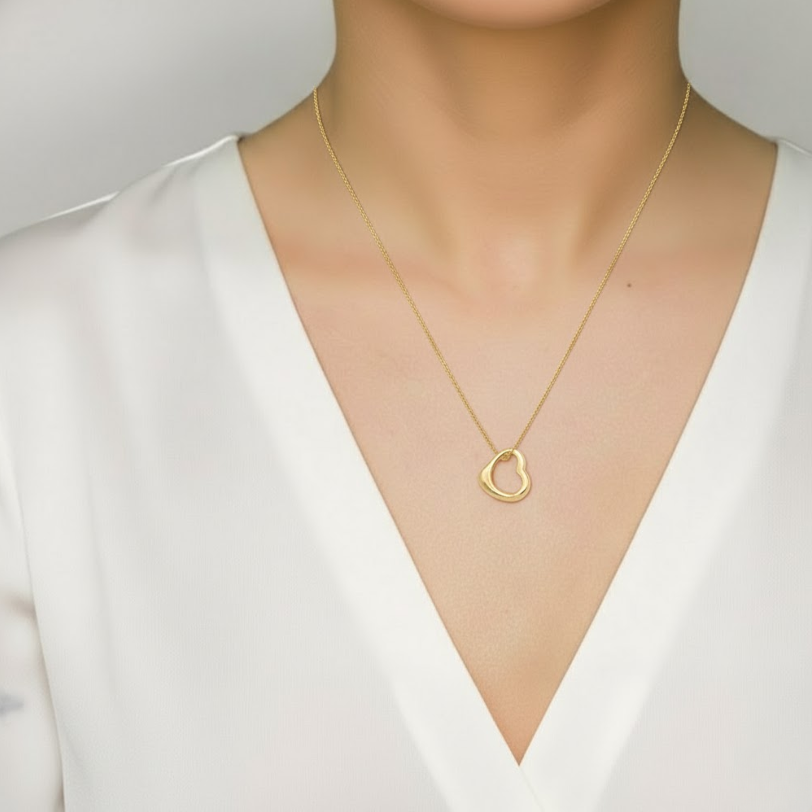 Elegant Gold Heart Necklace with Open Heart Pendant, crafted from 18k Gold Vermeil. Perfect for daily wear and gifting.