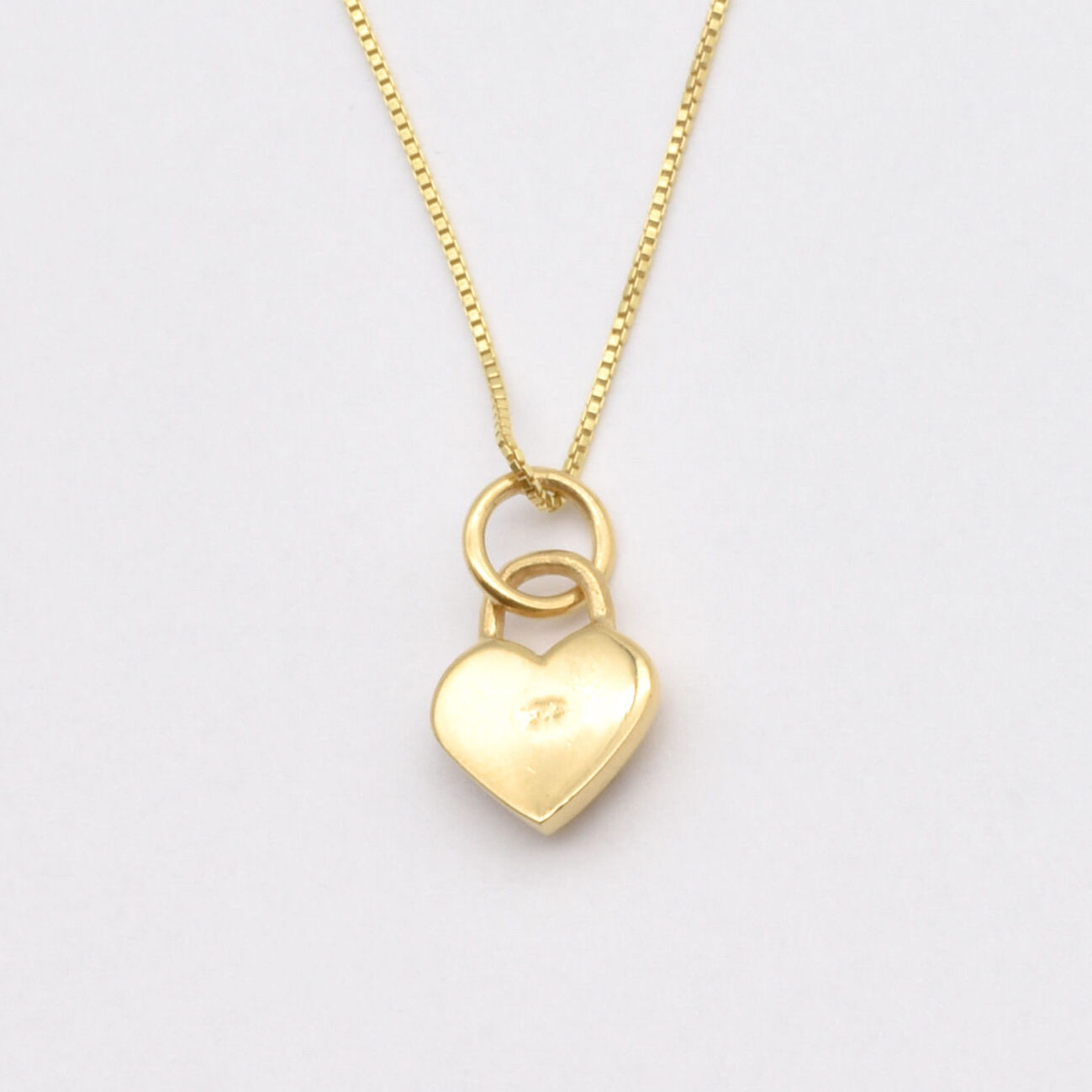 Dazzling Gold Heart Pendant Necklace with a heart lock motif, crafted from 18k Gold Vermeil for daily elegance and memorable gifting.