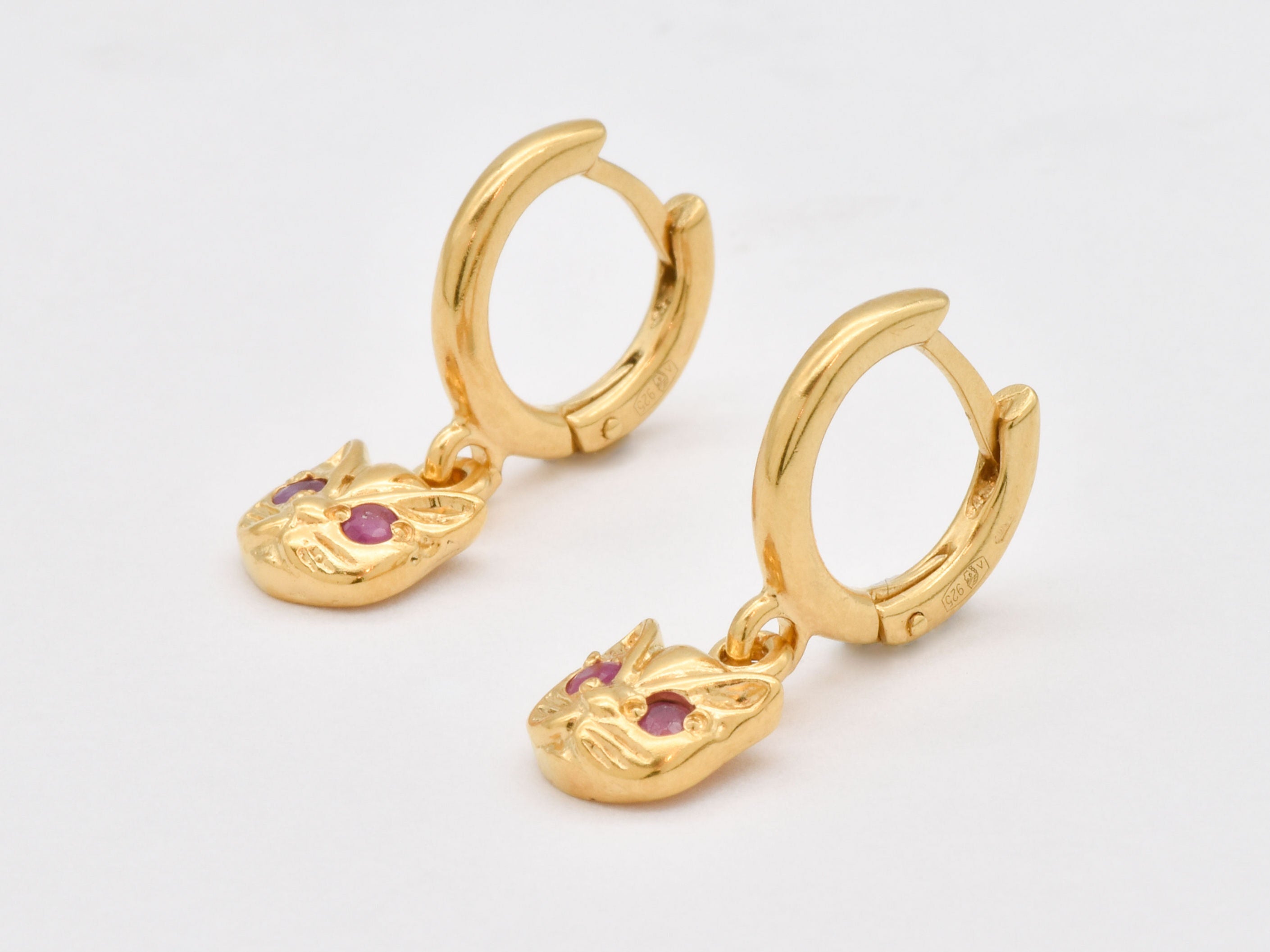 Stunning 18k Gold Vermeil Earrings with round natural red rubies, ideal for elevating everyday style and celebrating special moments.
