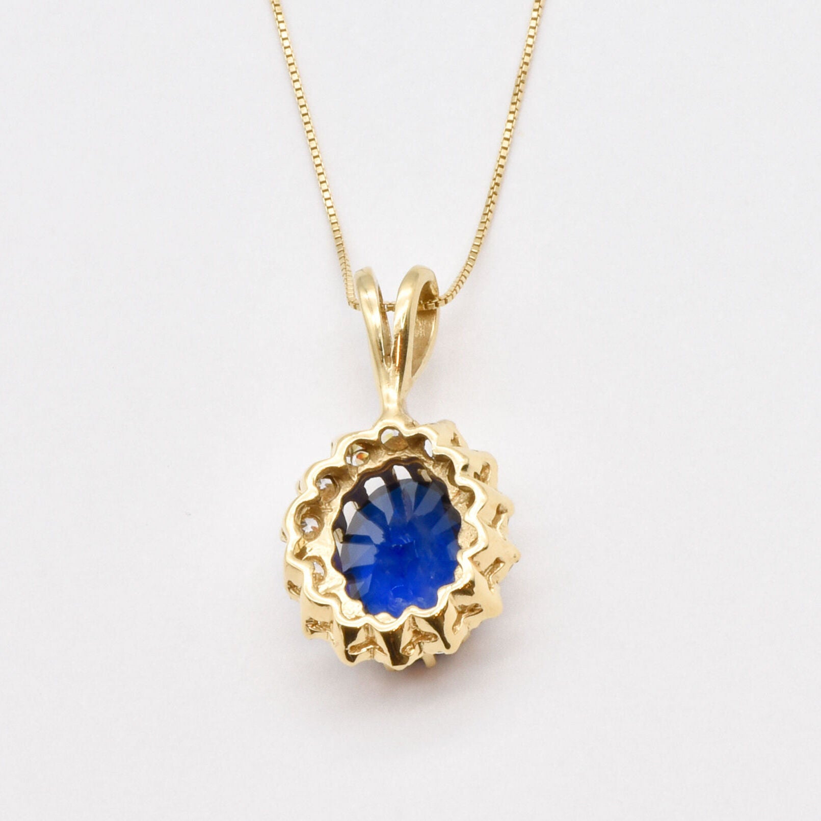 18k Gold Vermeil Halo Pendant featuring Created Blue Sapphire, a meaningful September gift that embodies loyalty and style.