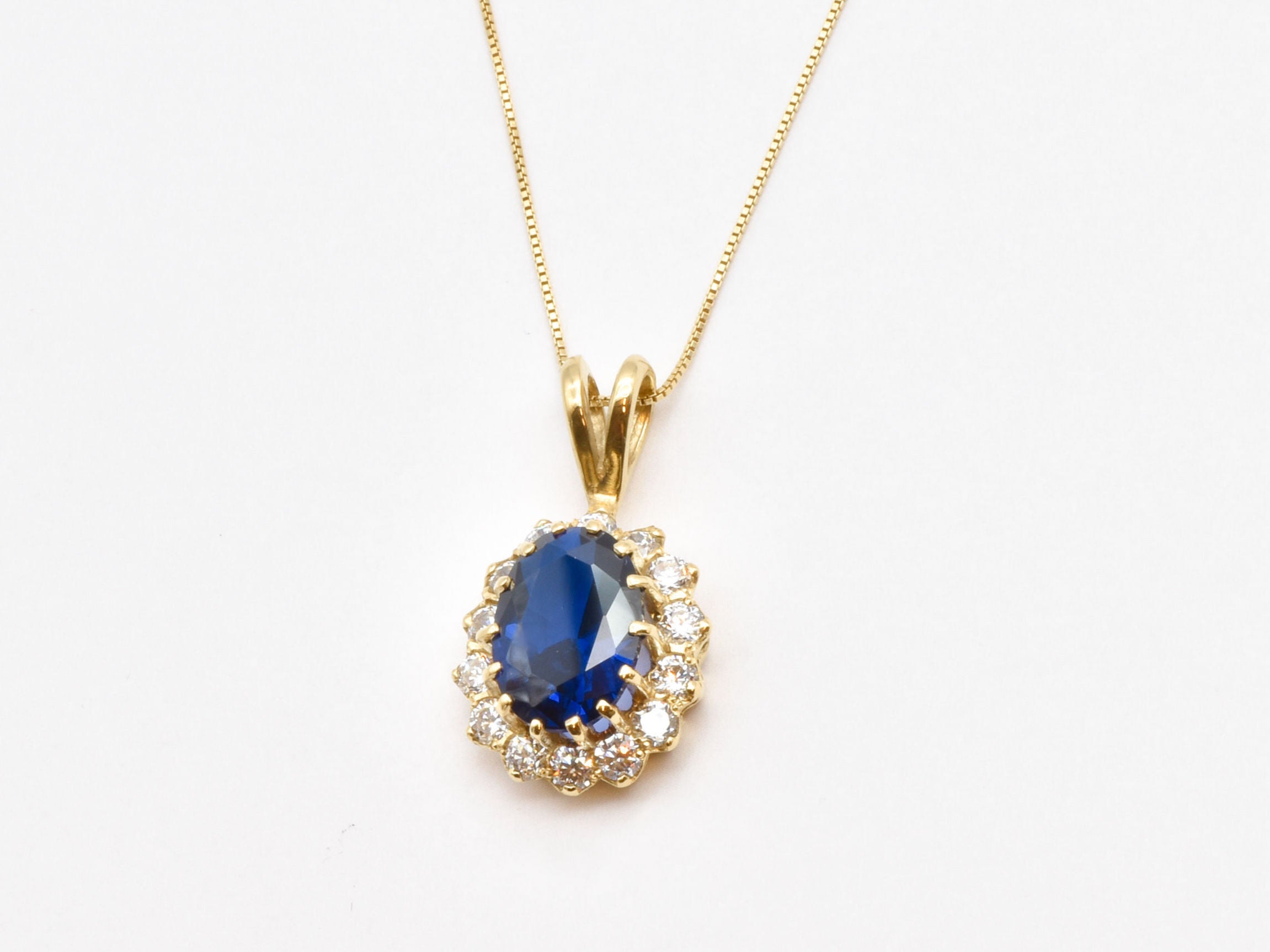 Created Sapphire Pendant made in 18k Gold Vermeil with Oval Created Blue Sapphire in Halo setting, September Birthstone gift idea, symbolizes sincerity, truth, and faithfulness, ideal for everyday wear and perfect for birthday gifting and special occasions.