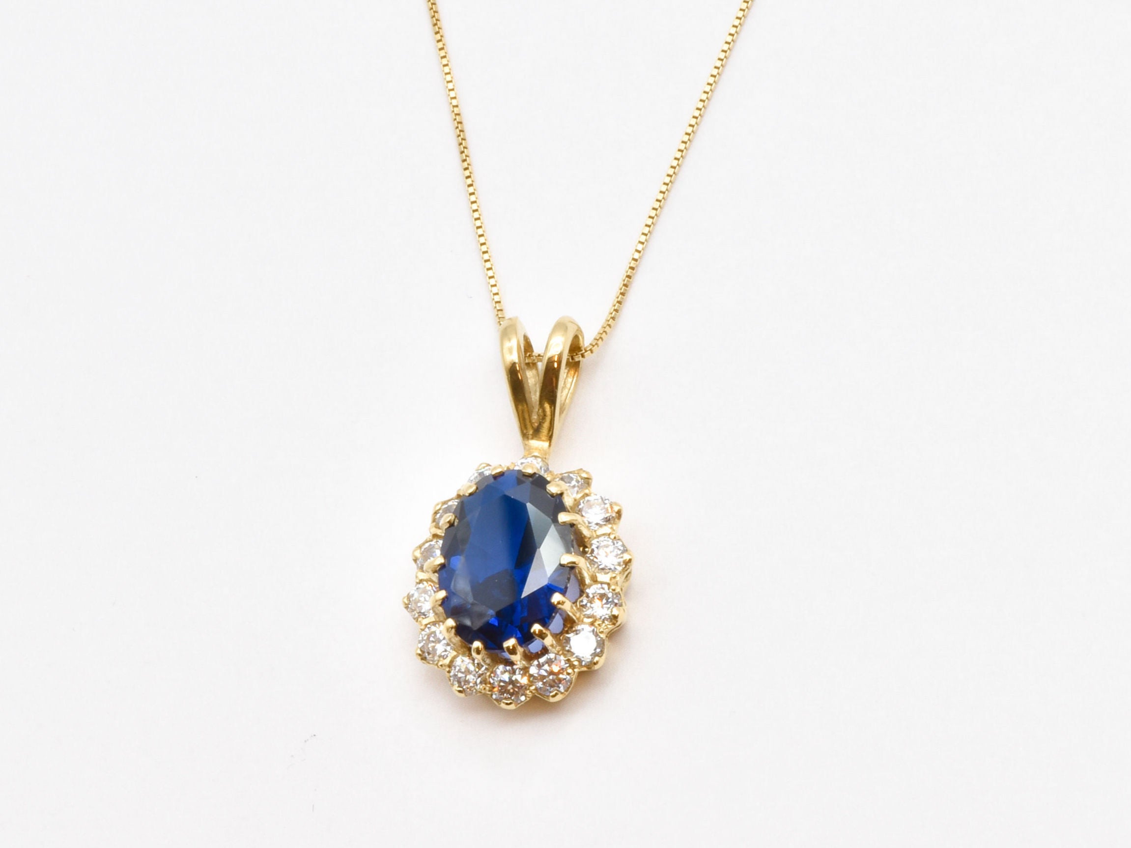 Created Sapphire Pendant made in 18k Gold Vermeil with Oval Created Blue Sapphire in Halo setting, September Birthstone gift idea, symbolizes sincerity, truth, and faithfulness, ideal for everyday wear and perfect for birthday gifting and special occasions.