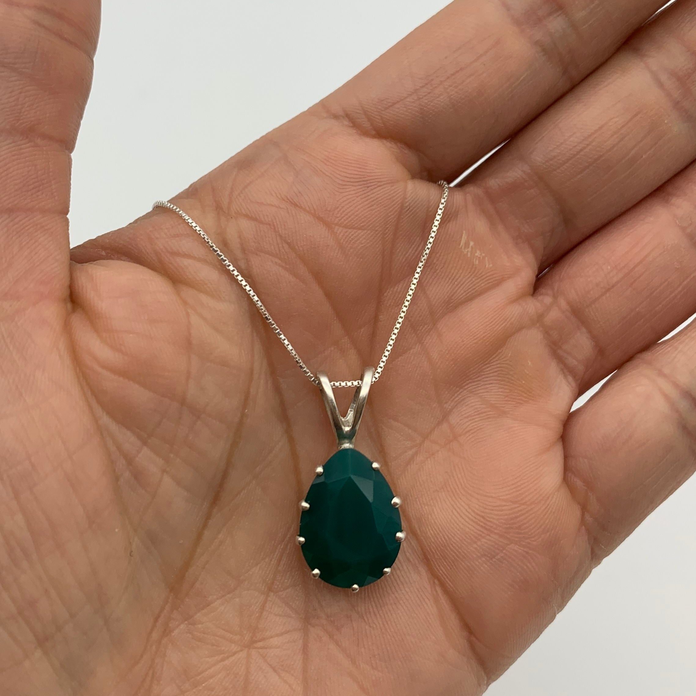 Elegant 925 Sterling Silver Emerald Pendant featuring a vibrant green emerald, ideal for May birthdays and special occasions.