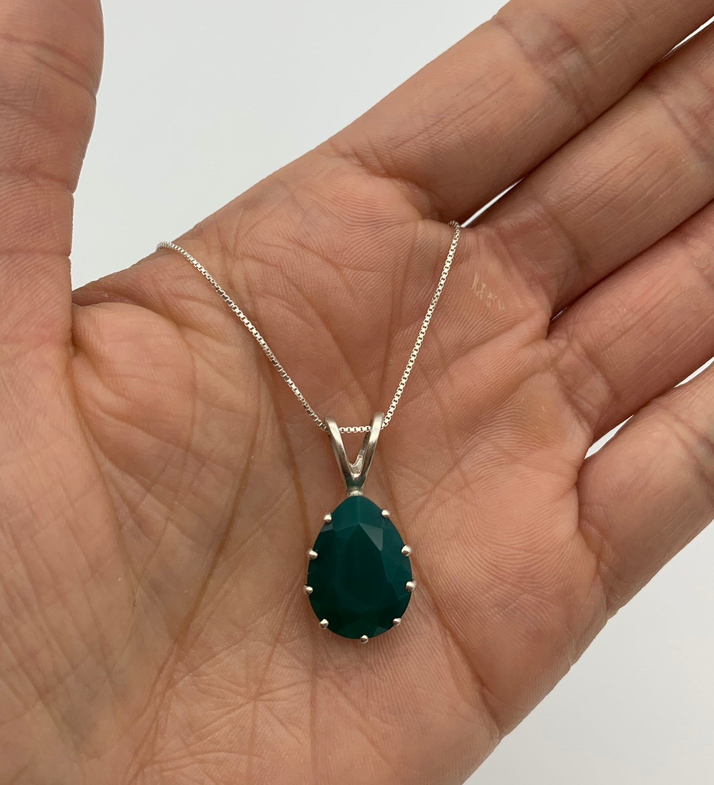 Elegant 925 Sterling Silver Emerald Pendant featuring a vibrant green emerald, ideal for May birthdays and special occasions.