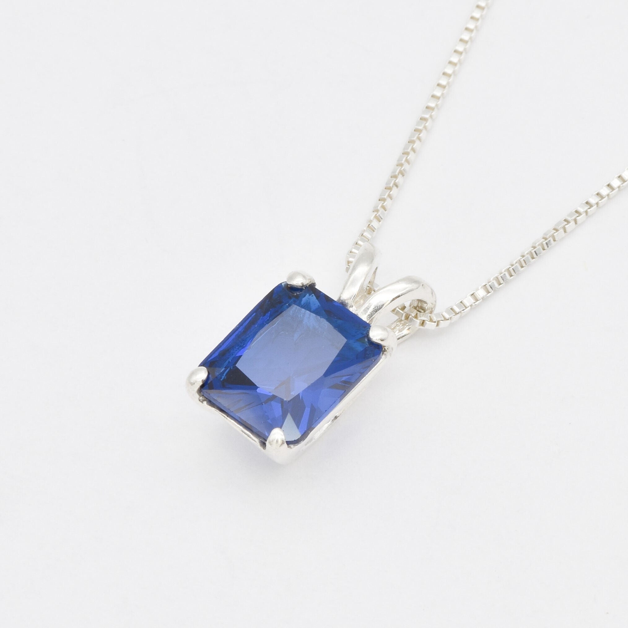 Elegant Created Sapphire Pendant in 925 Sterling Silver, featuring a stunning blue baguette sapphire, perfect for September birthdays.