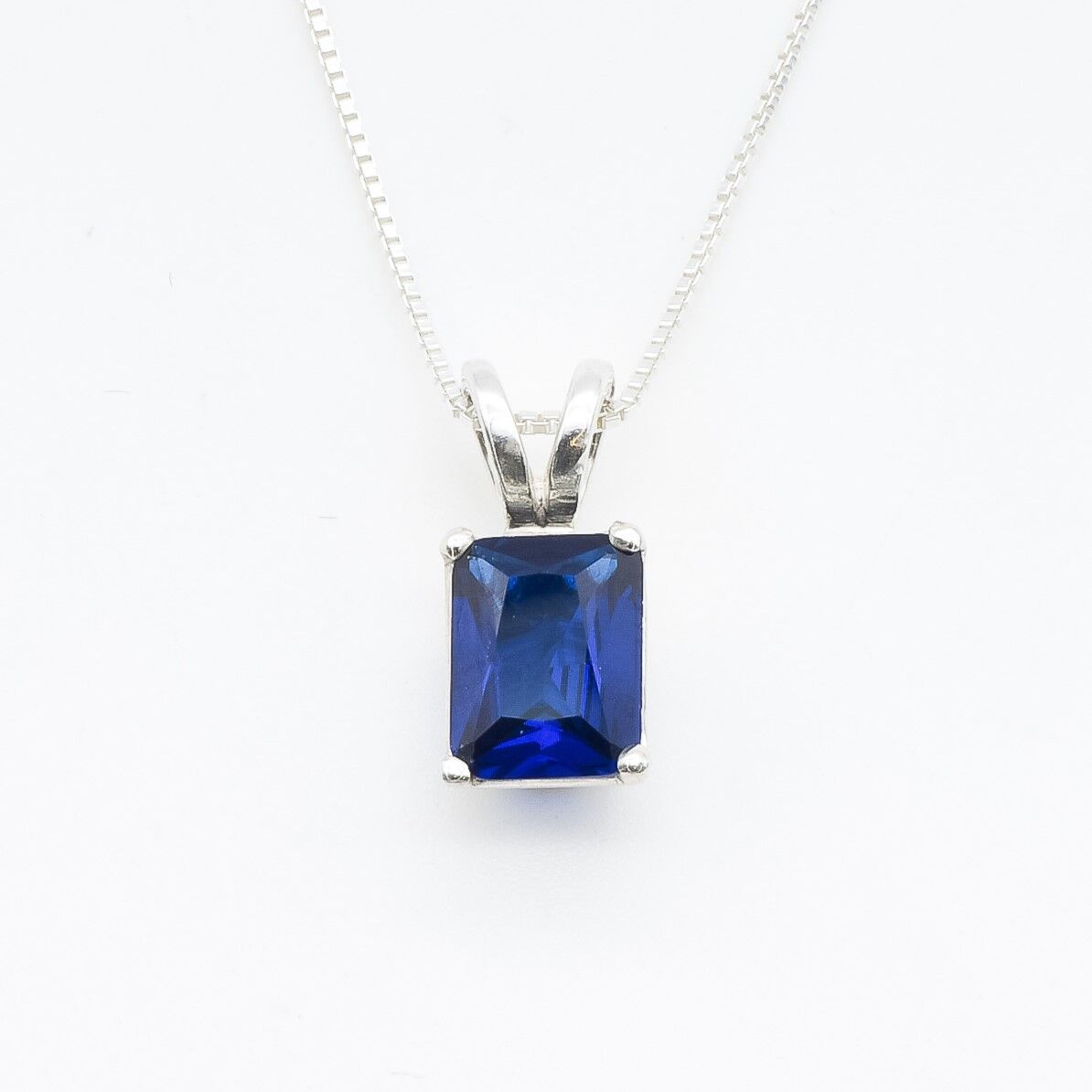 Created Sapphire Pendant made in 925 Sterling Silver with Baguette Created Blue Sapphire in Prong setting, September Birthstone gift idea, symbolizes sincerity, truth, and faithfulness, ideal for everyday wear and perfect for birthday gifting and special occasions.