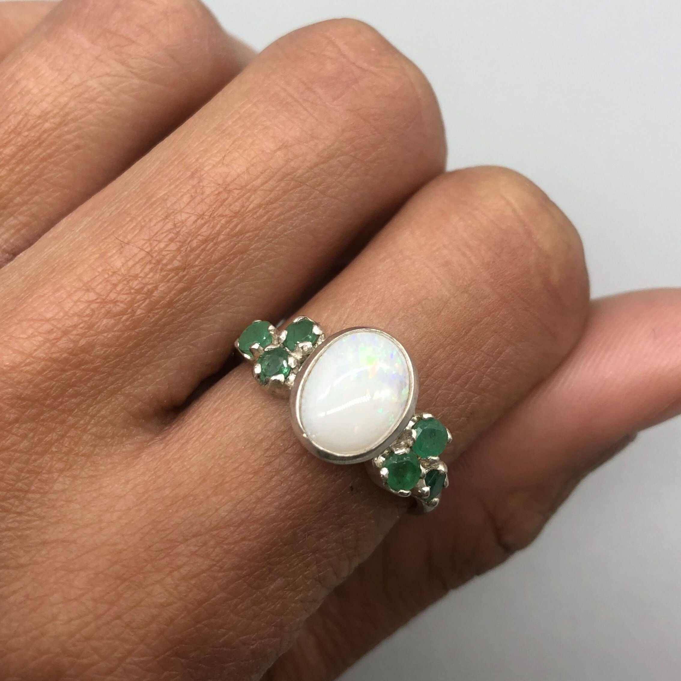925 sterling silver ring with bezel-set oval Ethiopian opal, October birthstone symbolizing purity and truth, perfect gift.