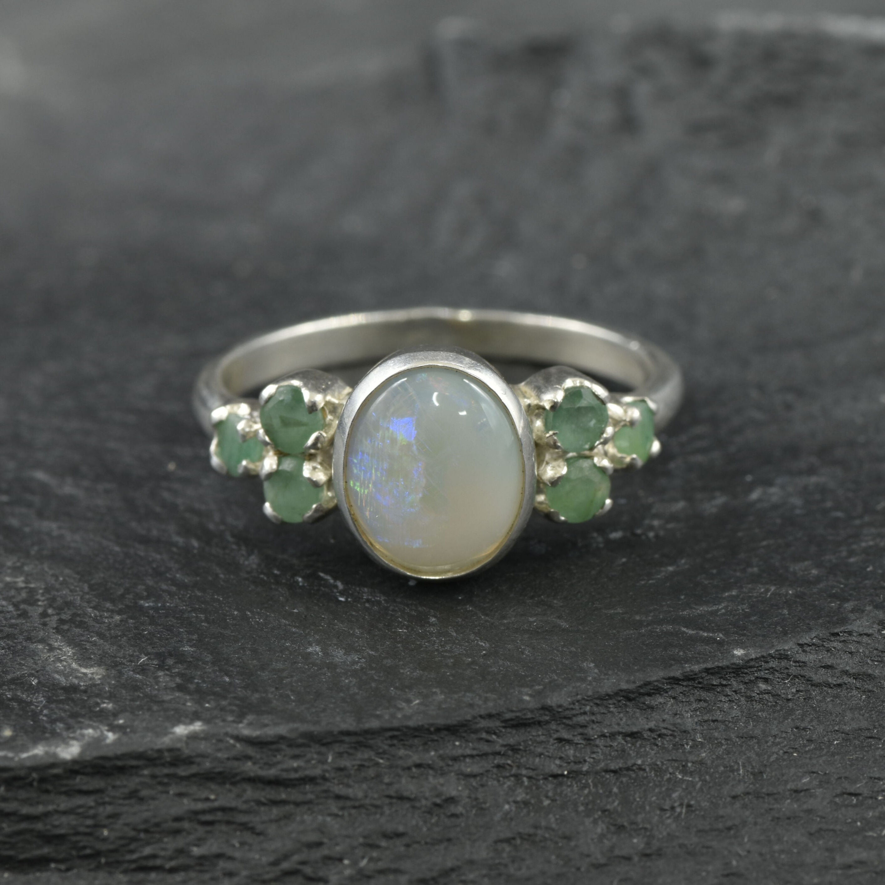 Oval Ethiopian fire opal bezel-set in 925 sterling silver, October birthstone ring symbolizing hope.