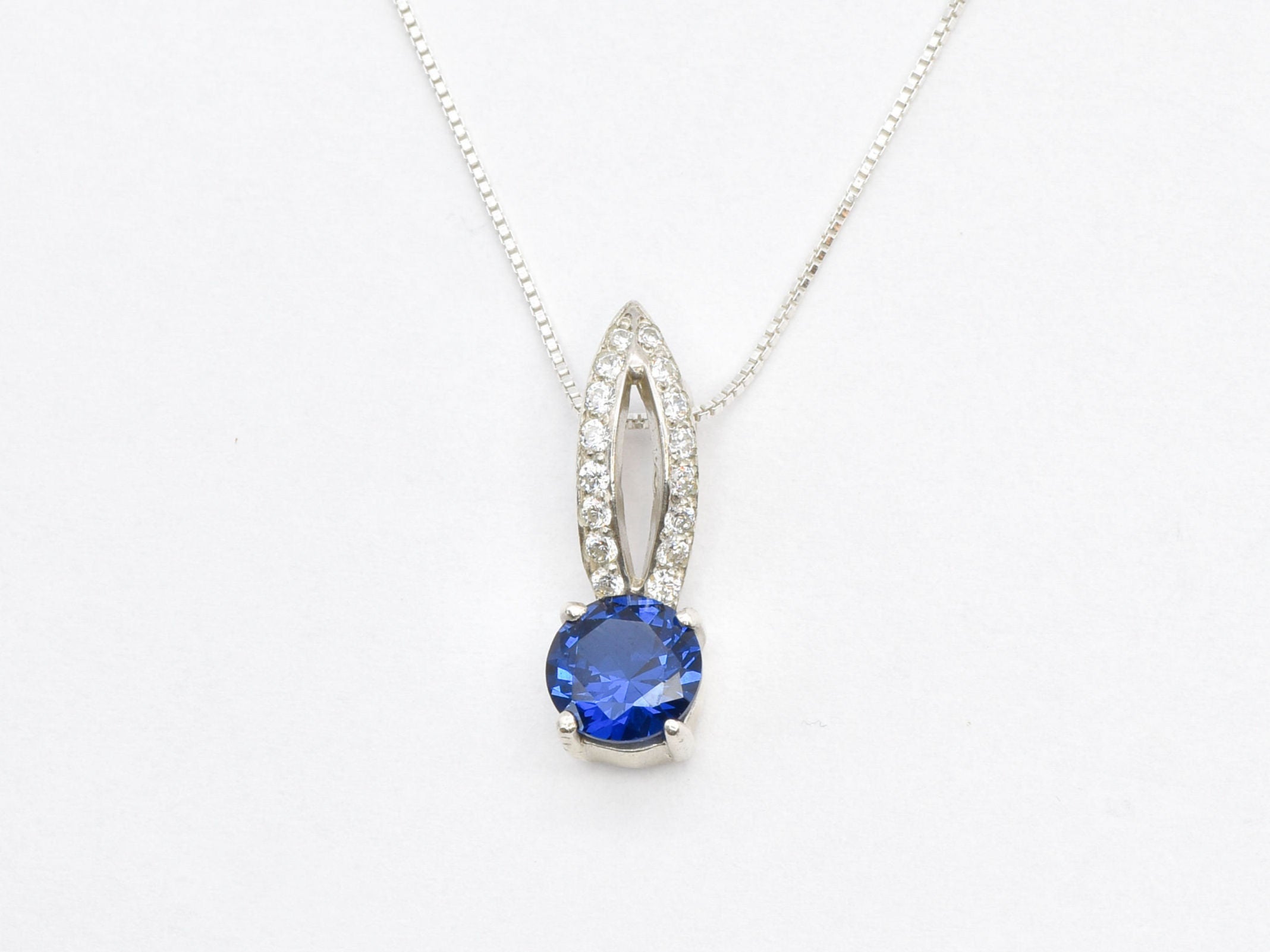 Created Sapphire Pendant made in 925 Sterling Silver with Round Created Blue Sapphire in Solitaire with Accents setting, September Birthstone gift idea, symbolizes sincerity, truth, and faithfulness, ideal for everyday wear and perfect for birthday gifting and special occasions.