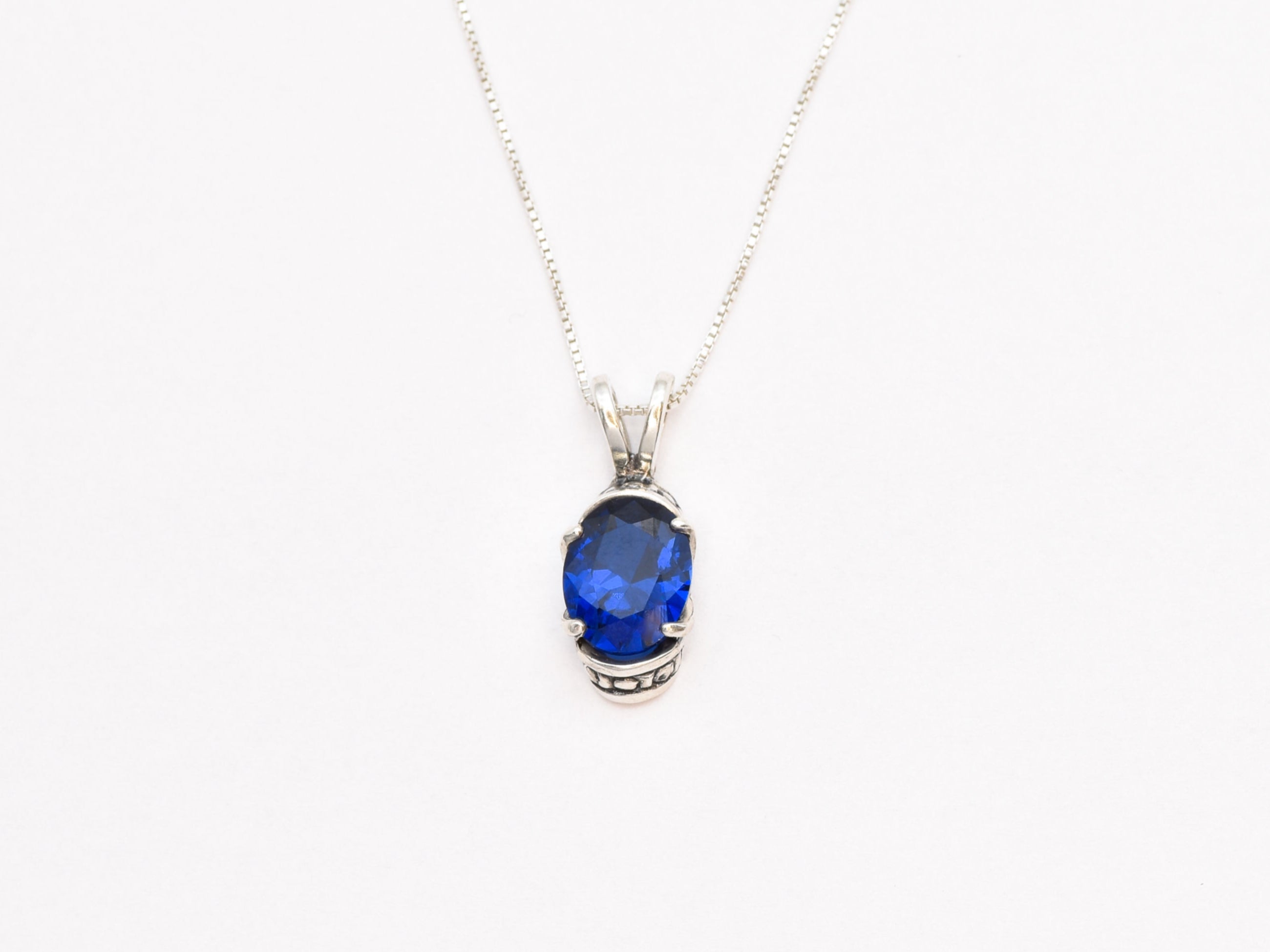 Created Sapphire Pendant made in 925 Sterling Silver with Baguette Created Blue Sapphire in Solitaire setting, September Birthstone gift idea, symbolizes sincerity, truth, and faithfulness, ideal for everyday wear and perfect for birthday gifting and special occasions.