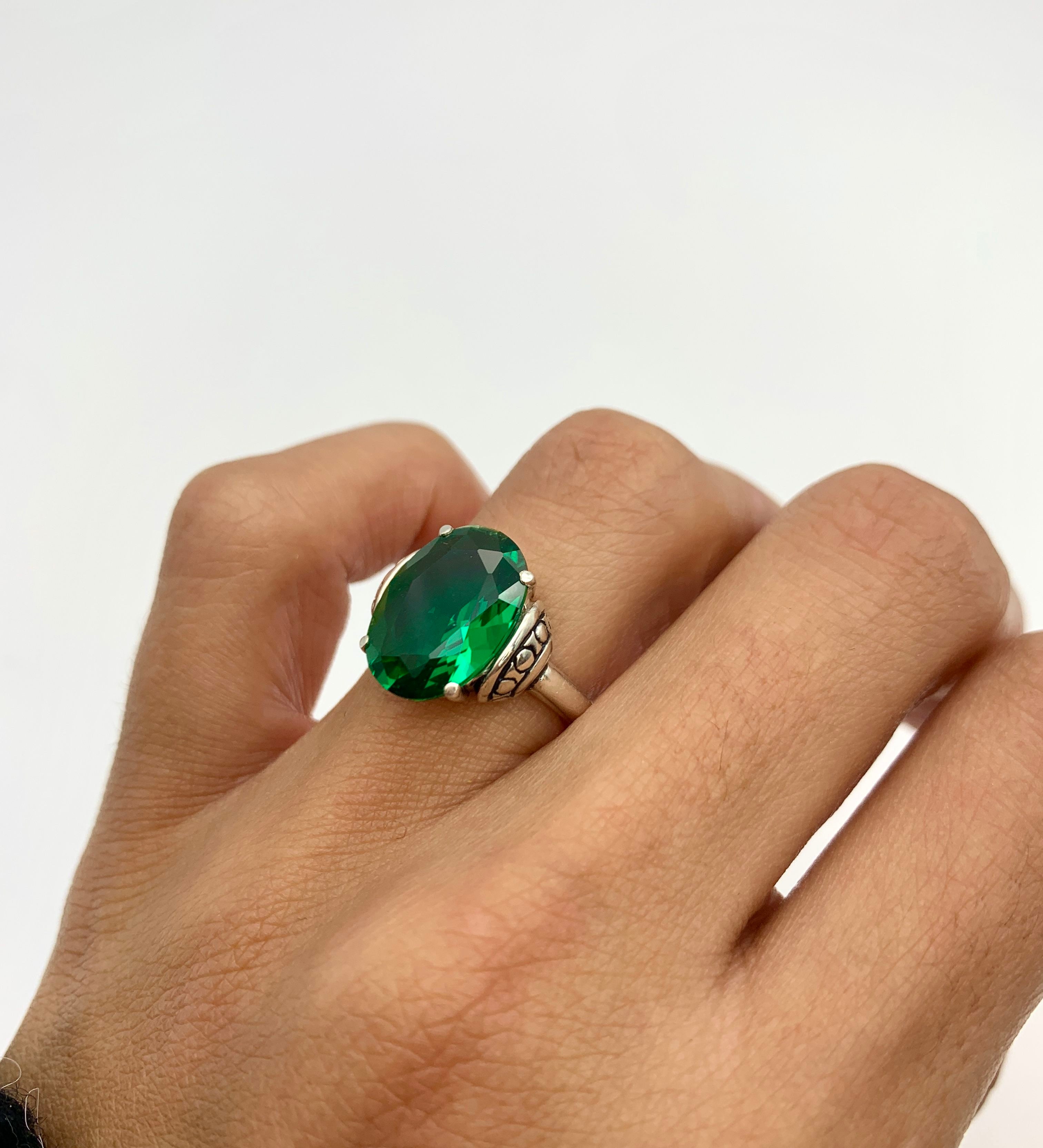 Elegant 925 Sterling Silver ring featuring a stunning oval Created Green Emerald, ideal May birthstone gift for special occasions.