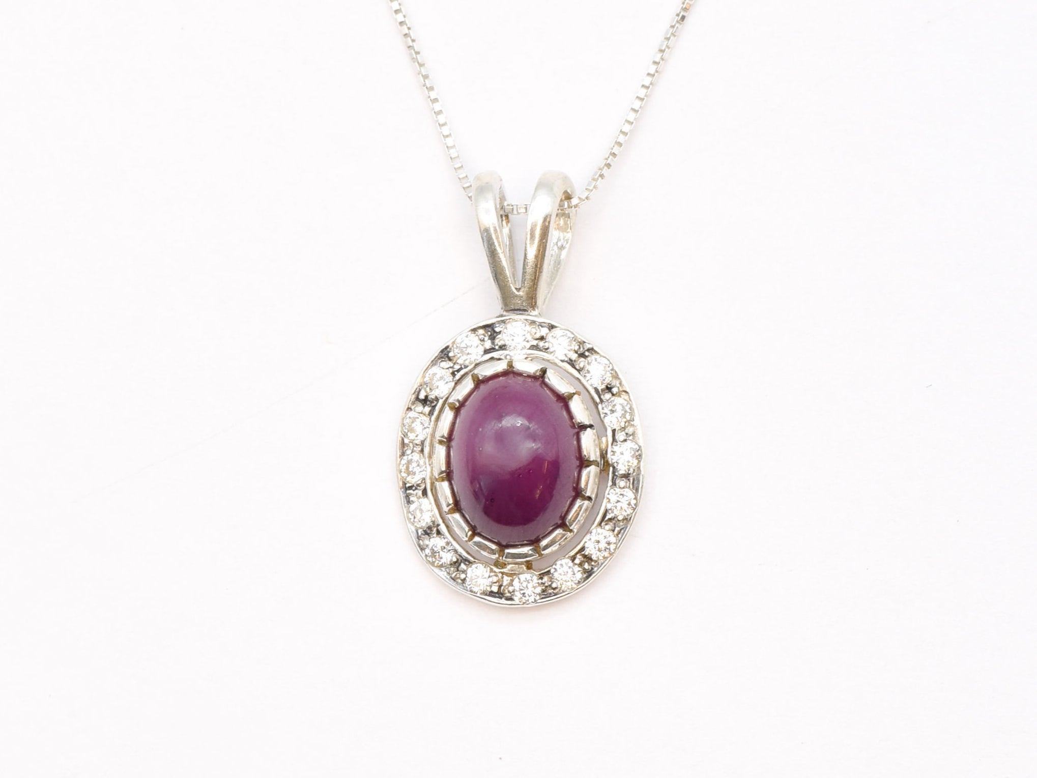 Natural Ruby Pendant made in 925 Sterling Silver with Oval Natural Red Ruby in Halo setting, July Birthstone gift idea, symbolizes nobility, purity, and passion, ideal for everyday wear and perfect for birthday gifting and special occasions.