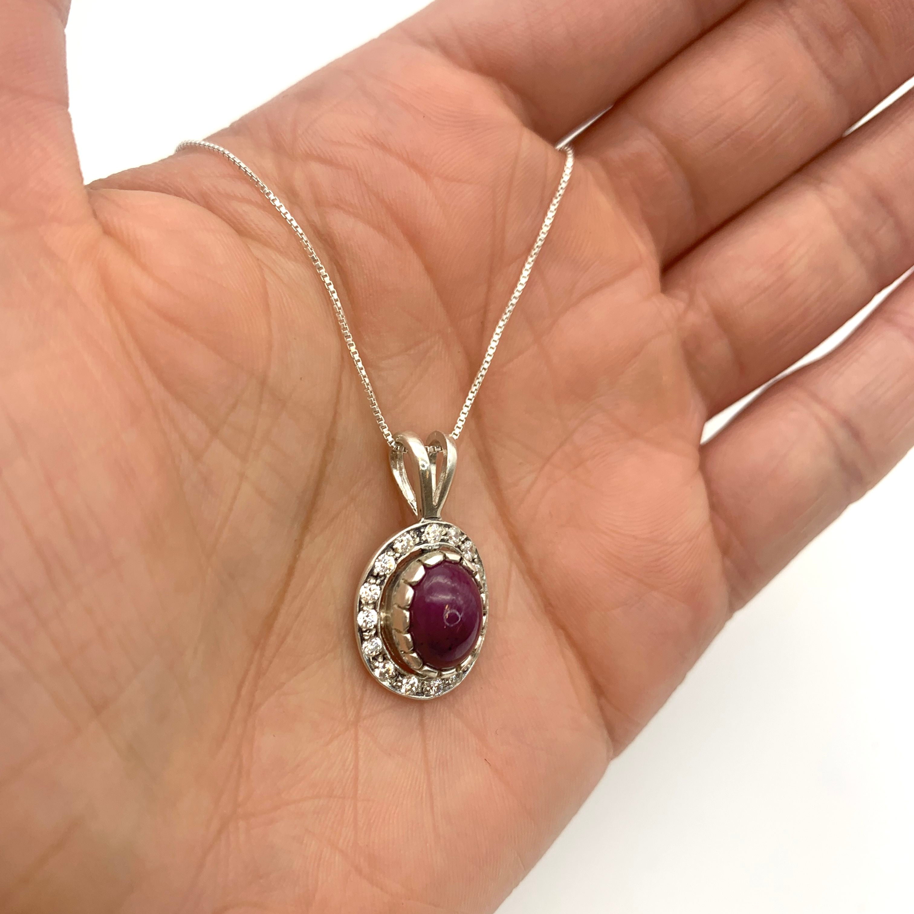 Sterling Silver Natural Ruby Pendant with Halo setting, July Birthstone, symbolizes passion and purity, great for gifting.