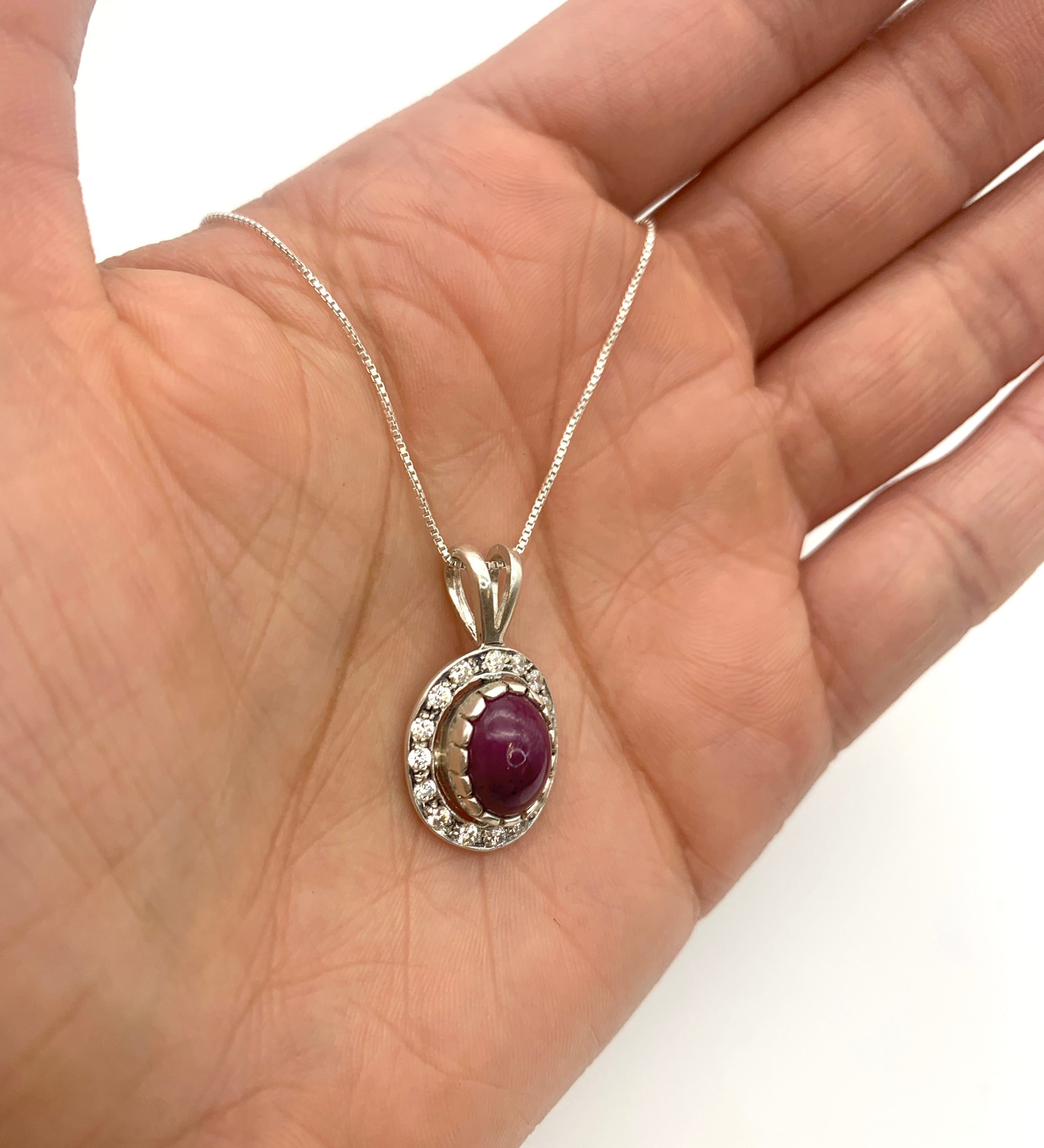 Sterling Silver Natural Ruby Pendant with Halo setting, July Birthstone, symbolizes passion and purity, great for gifting.