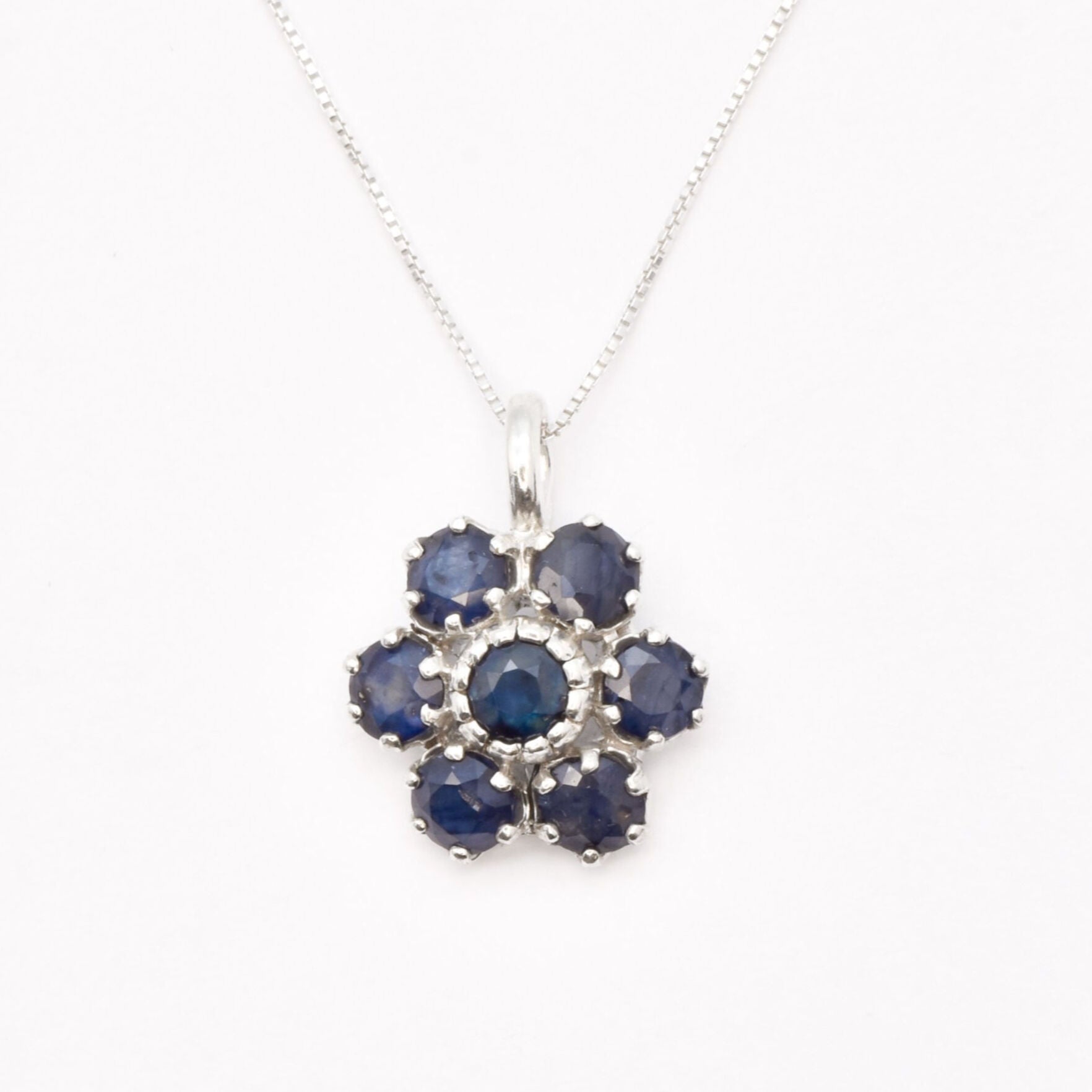 Sapphire Flower Pendant - Blue Flower Necklace - September Birthstone Necklace made in 925 Sterling Silver. Ideal for everyday wear and perfect for birthday gifting and special occasions.