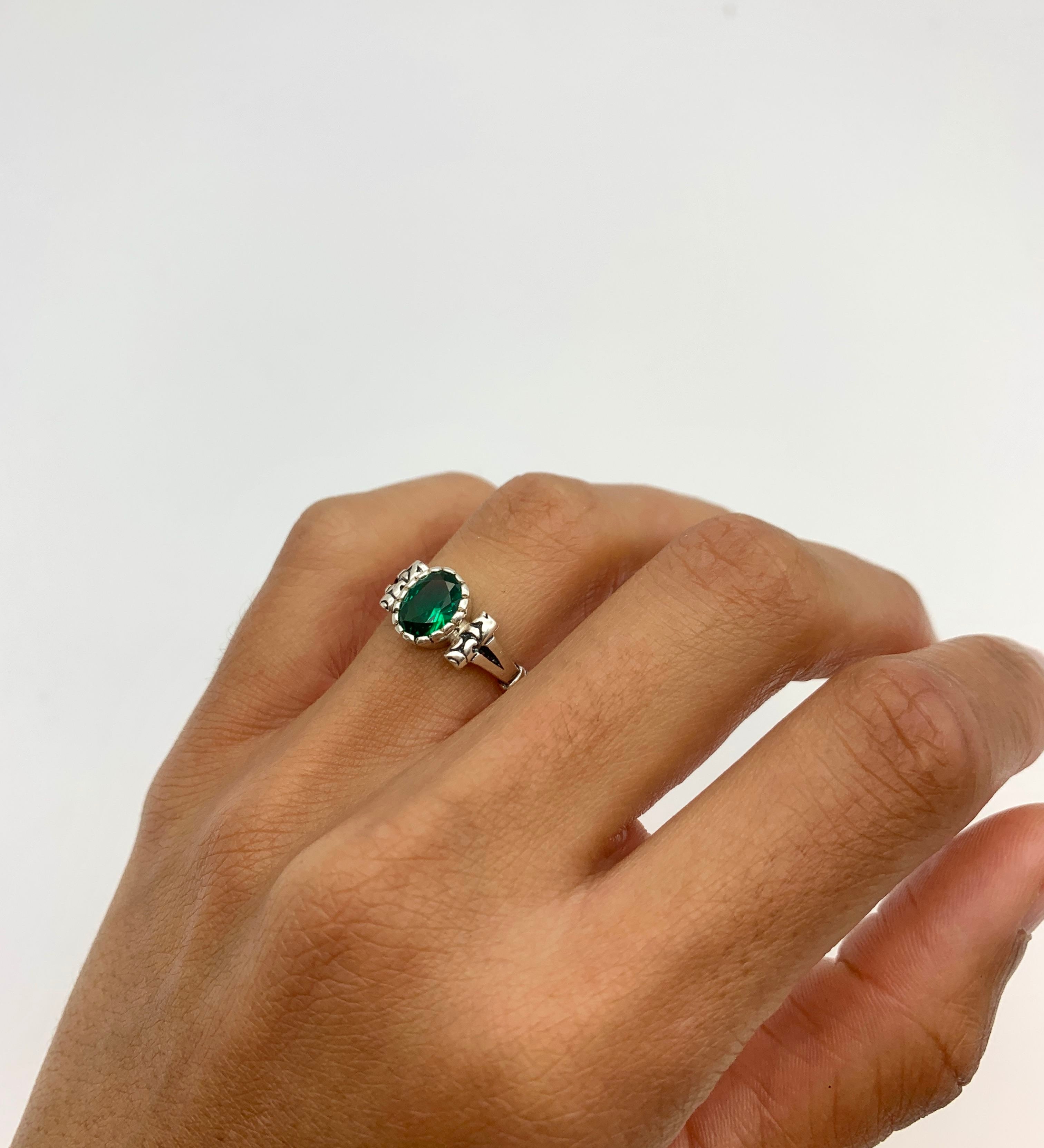 Elegant 925 Sterling Silver ring featuring a stunning oval Created Green Emerald, perfect for May birthdays and special occasions.