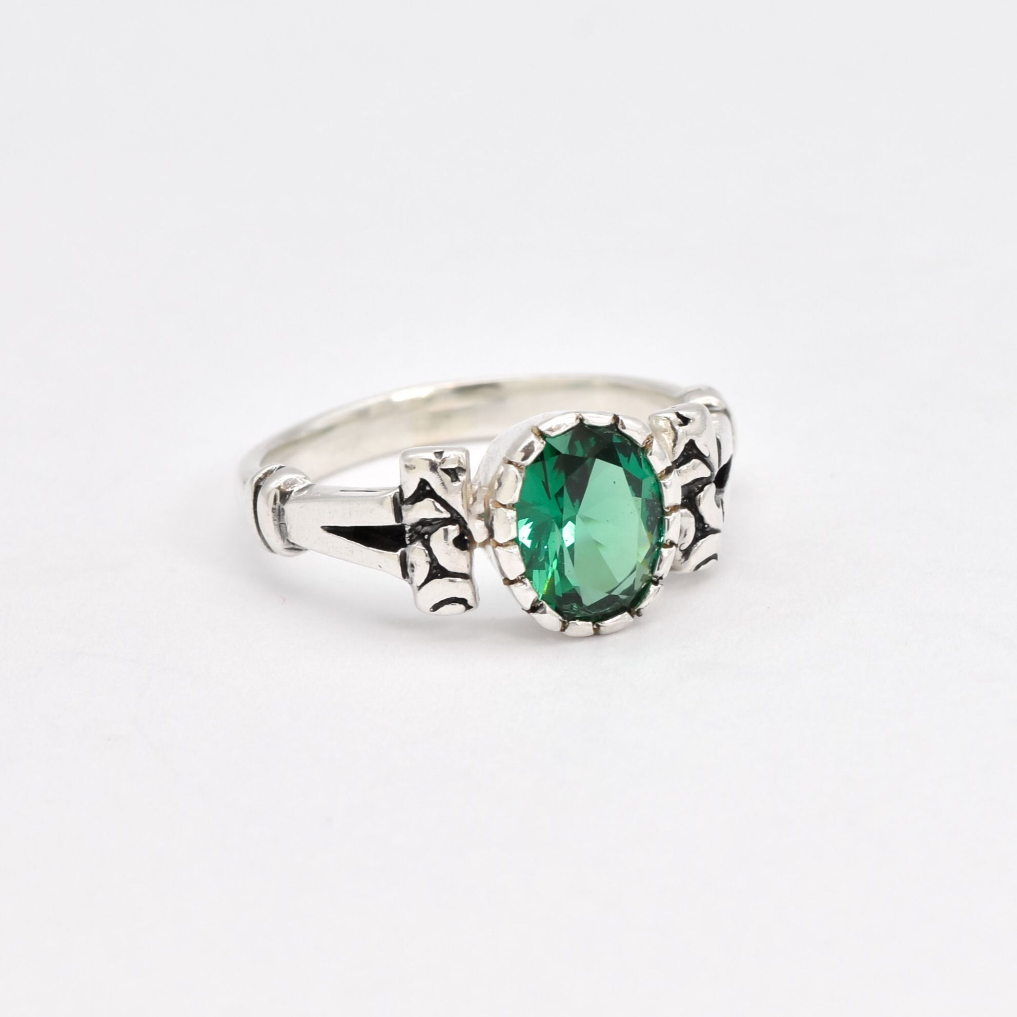 Delicate 925 Sterling Silver ring showcasing a lovely oval Created Green Emerald, perfect for everyday elegance and May birthdays.