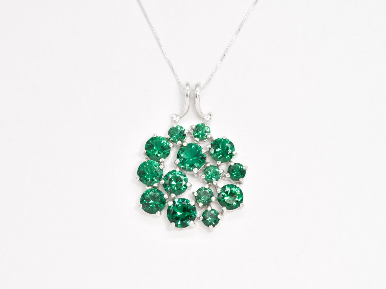 Exquisite cluster-set emerald pendant in 925 sterling silver, a thoughtful May birthday gift and a lovely everyday accessory.