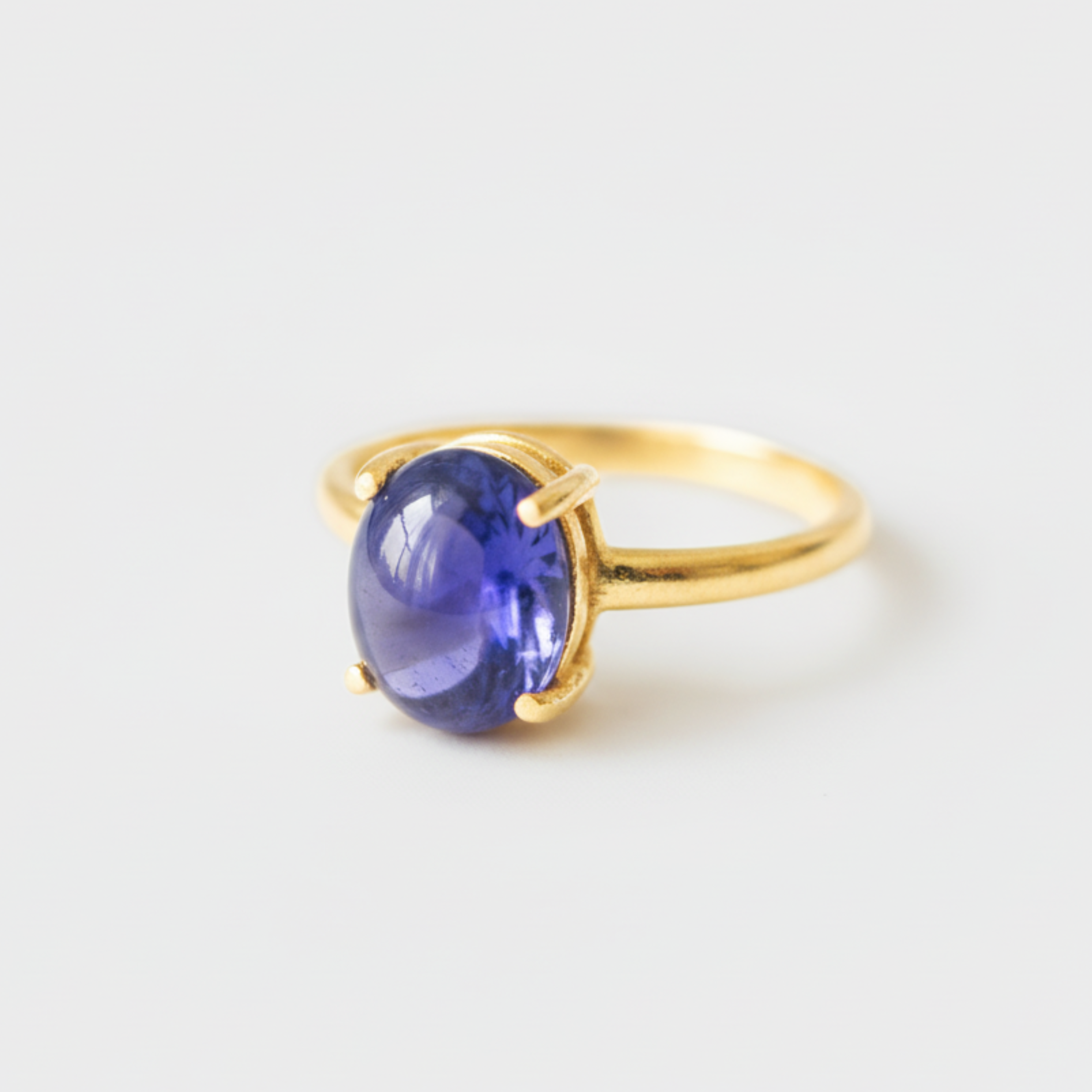 Stunning 18k Gold Vermeil Ring featuring a rich purple oval Tanzanite, designed for stylish everyday wear and memorable gifts.