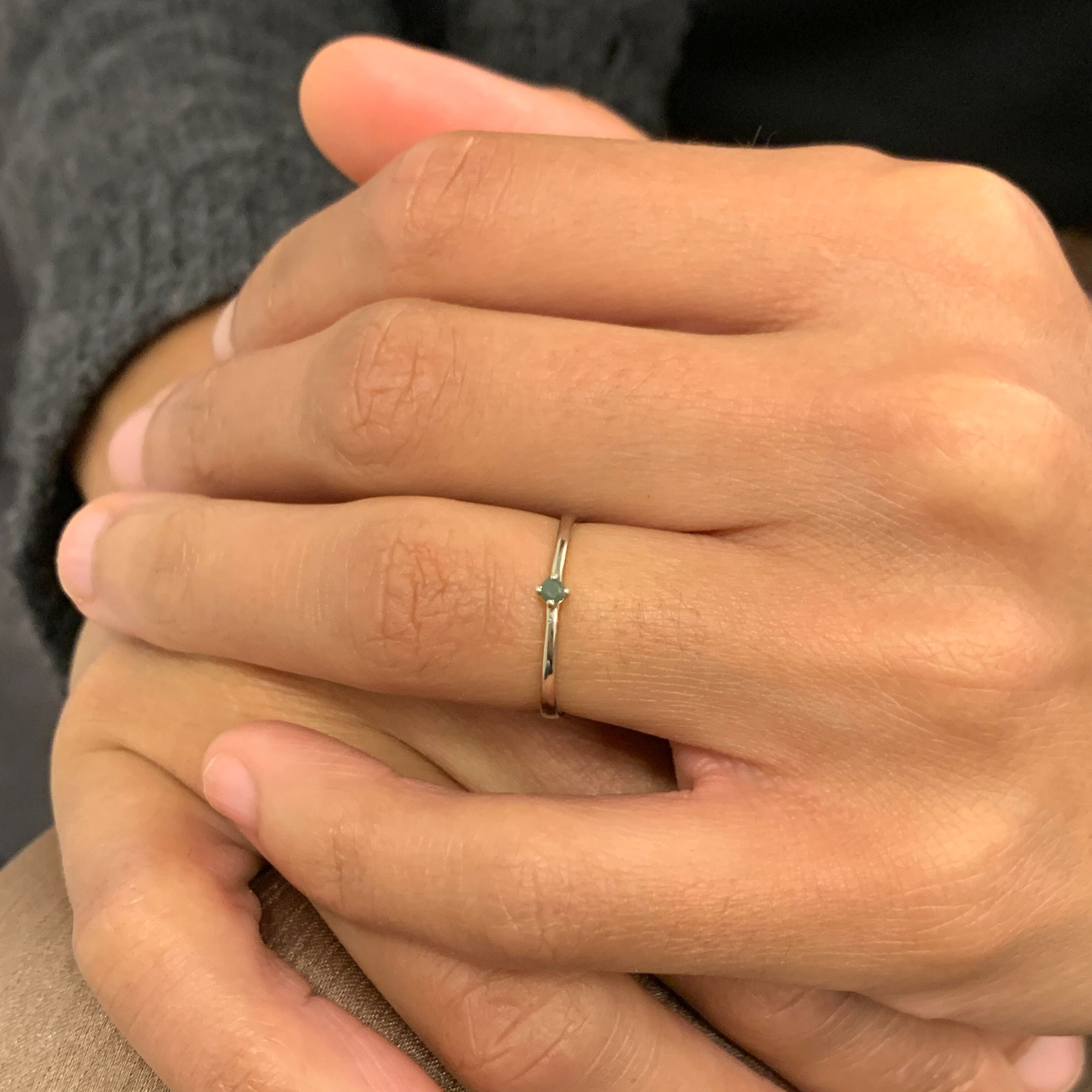 Dainty Emerald Ring worn on ring finger
